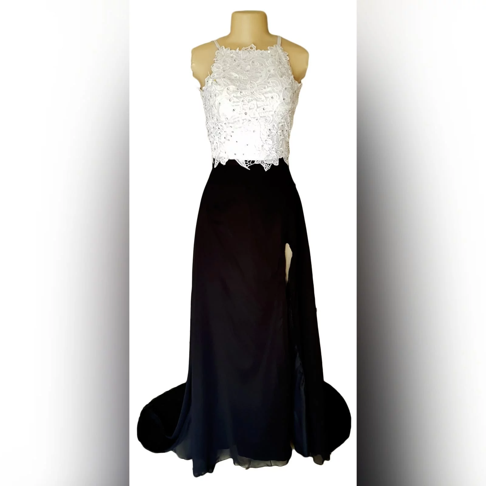2 piece black and white prom dress 2 2 piece black and white prom dress, flowy black skirt with a high slit and a train. White lace beaded top.