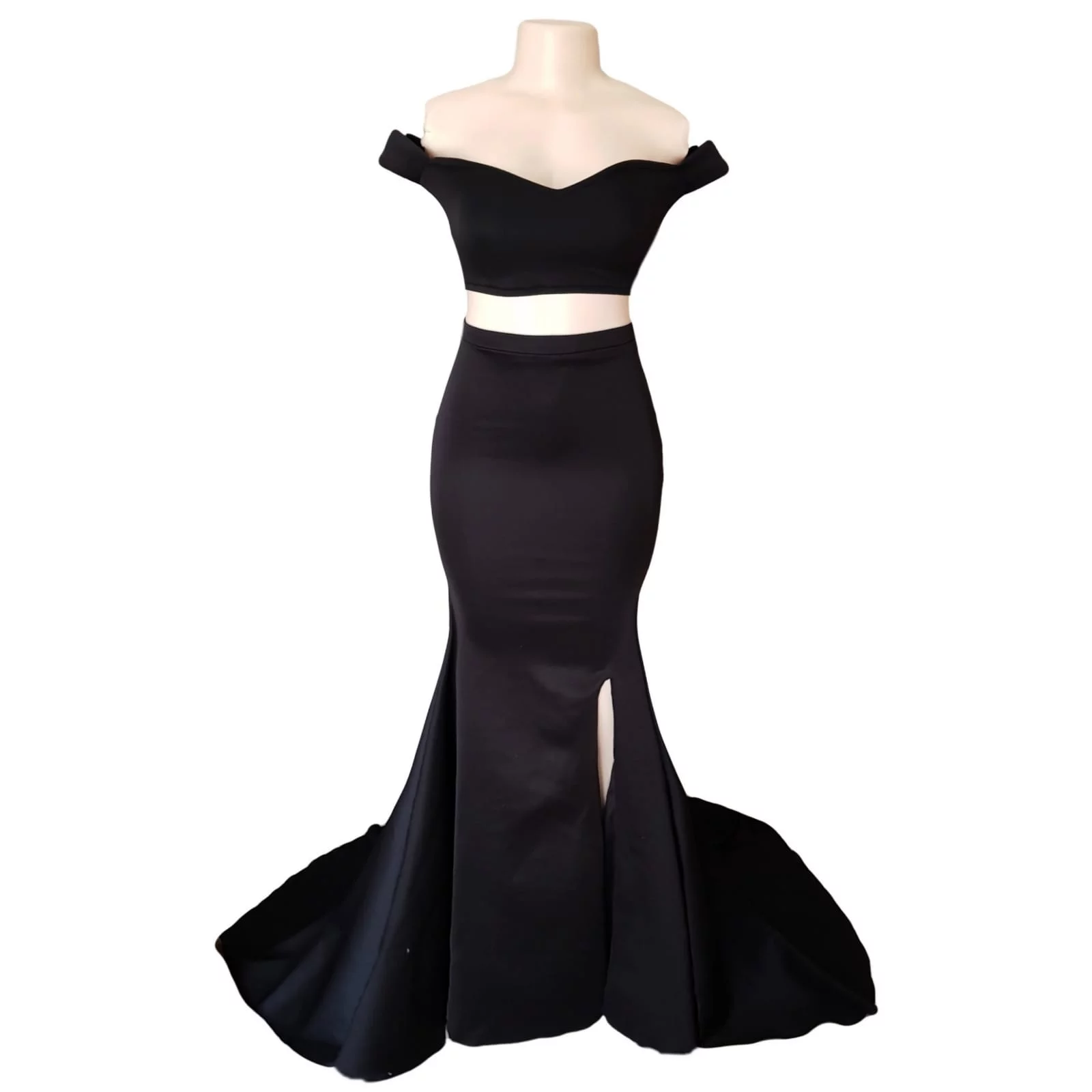 2 piece black off shoulder matric dance dress with a crop top 6 2 piece black off shoulder matric dance dress with a crop top. Lace-up back. Long skirt with knee length slit and a train.