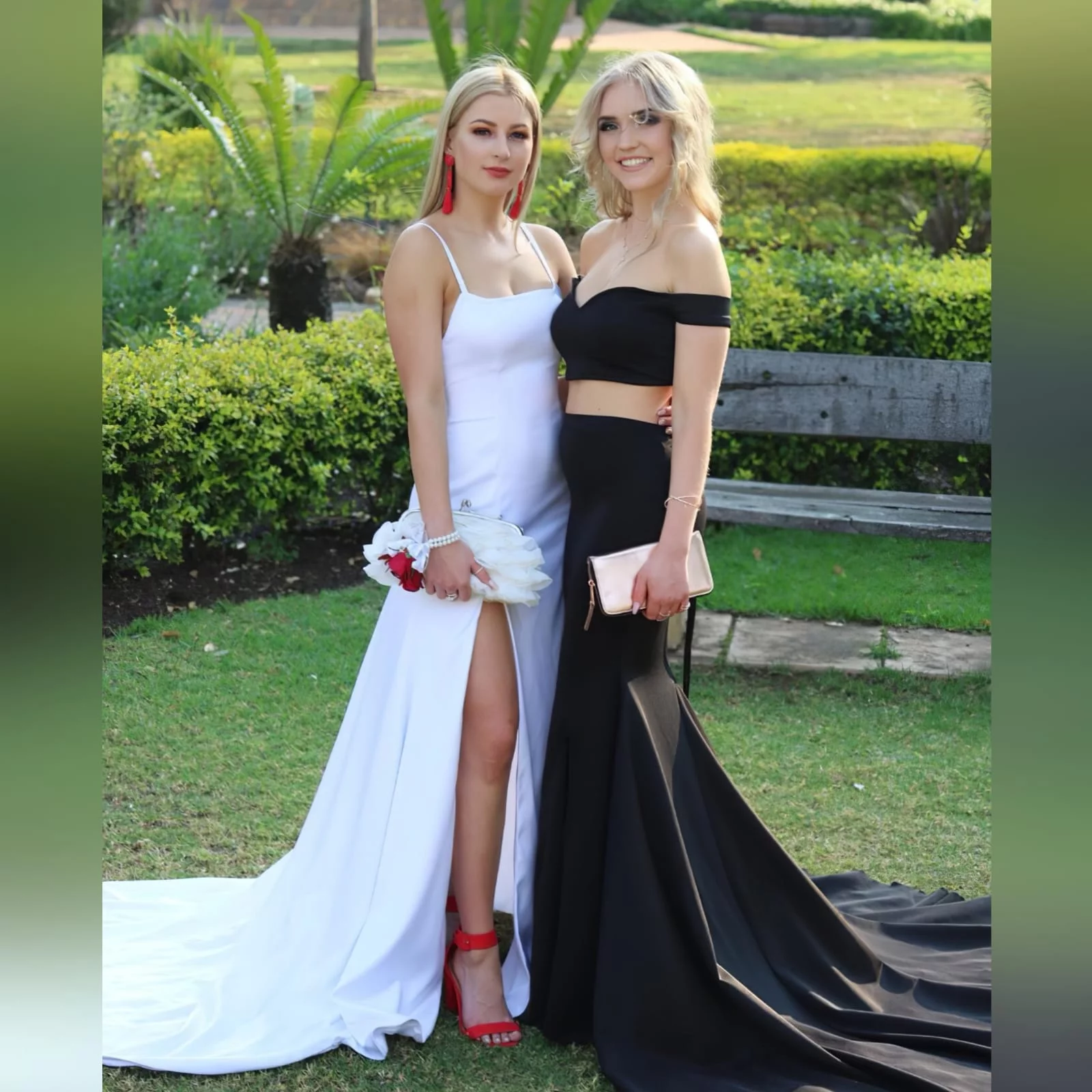 2 piece black off shoulder matric dance dress with a crop top 4 2 piece black off shoulder matric dance dress with a crop top. Lace-up back. Long skirt with knee length slit and a train.