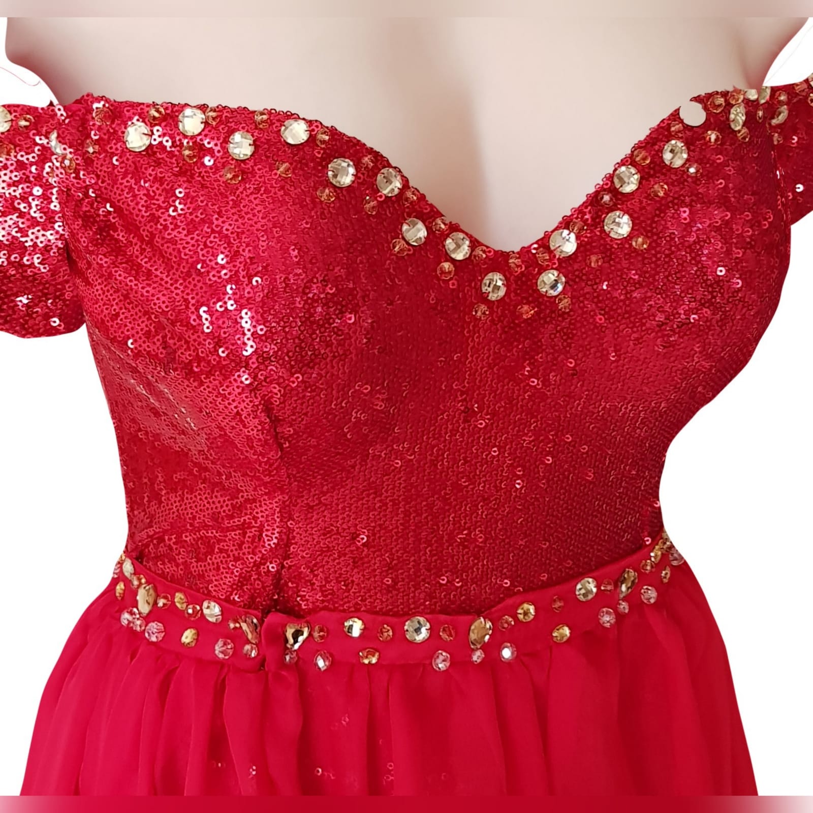 2 piece red sequins evening dress 4 2 piece red sequins evening dress. Short leg off shoulder sweetheart neckline bodysuit with a sheer long detachable skirt with 2 slits. Detailed with gold beads.