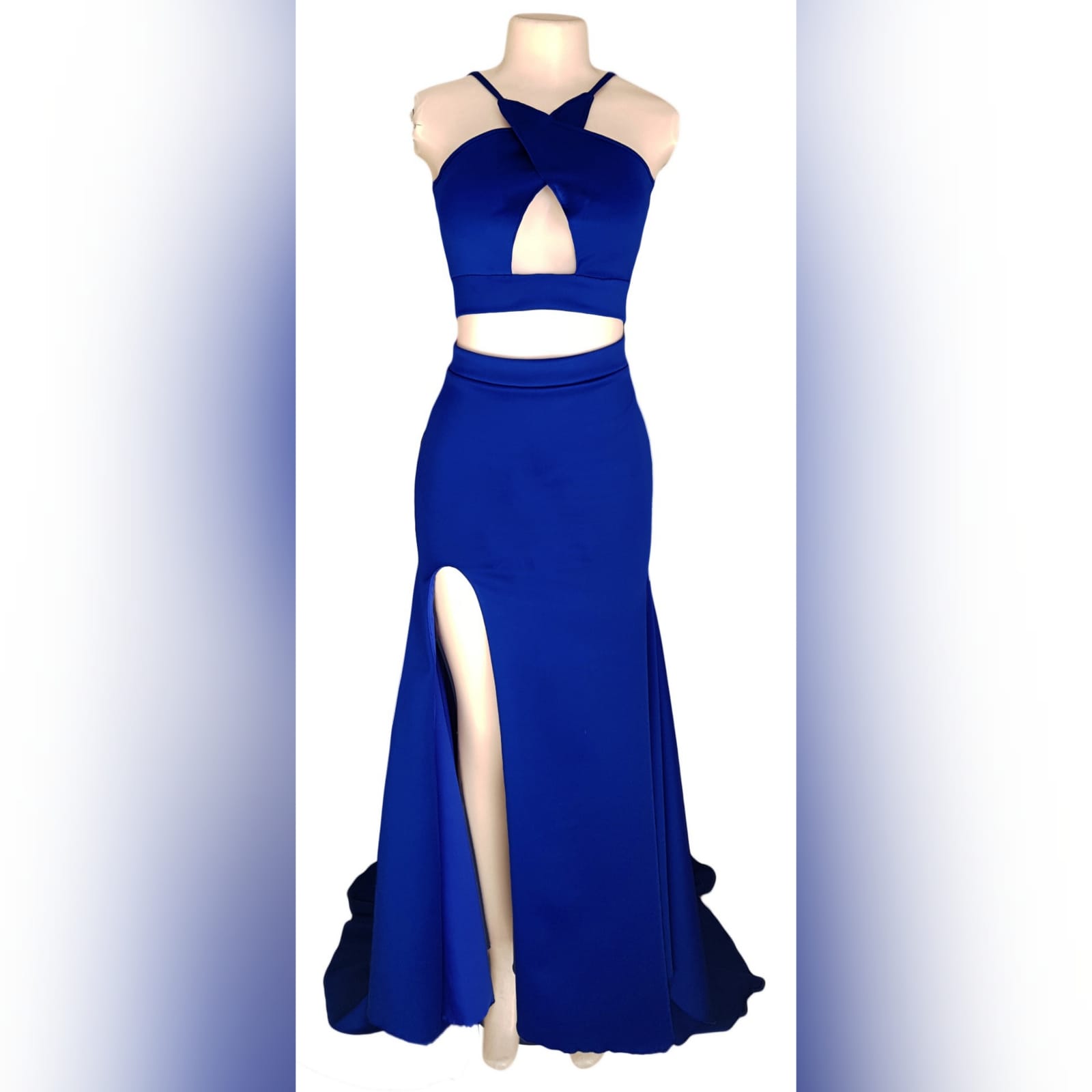 2 piece royal blue prom dress 1 2 piece royal blue prom dress. Crop top with cleavage opening. Fitted skirt with a slit and a train.