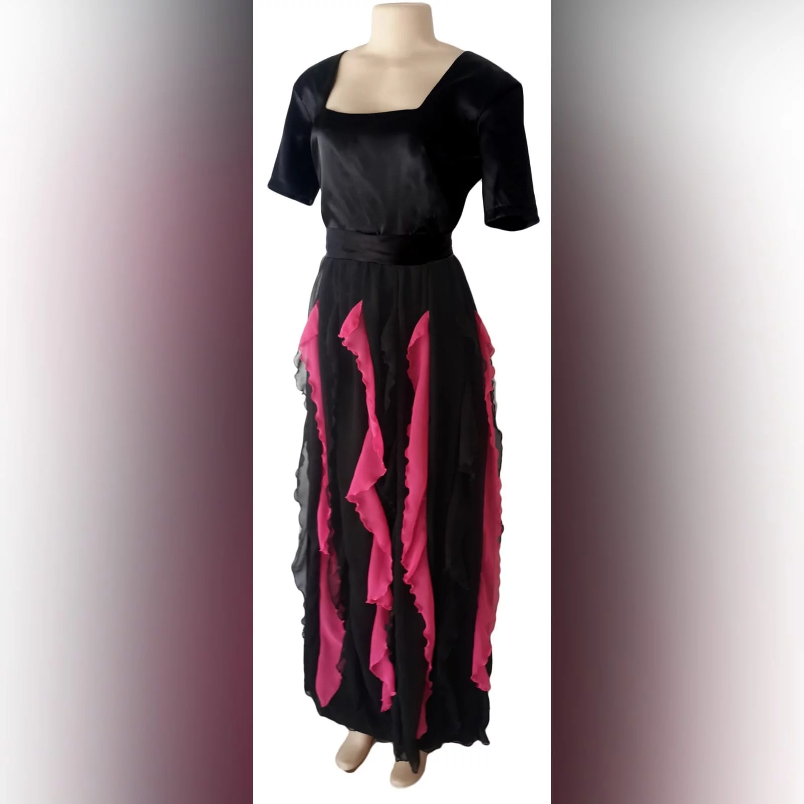 Black and pink evening dress 2 black & pink evening dress with square neckline short sleeves & vertical pink and black frills