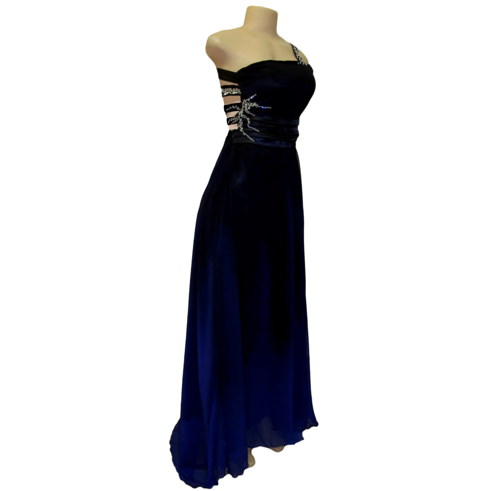 Black and royal blue flowy prom dress with a wide waist band 4 black and royal blue flowy prom dress with a wide waist band, an open back with strap design. With a train and silver detailing.