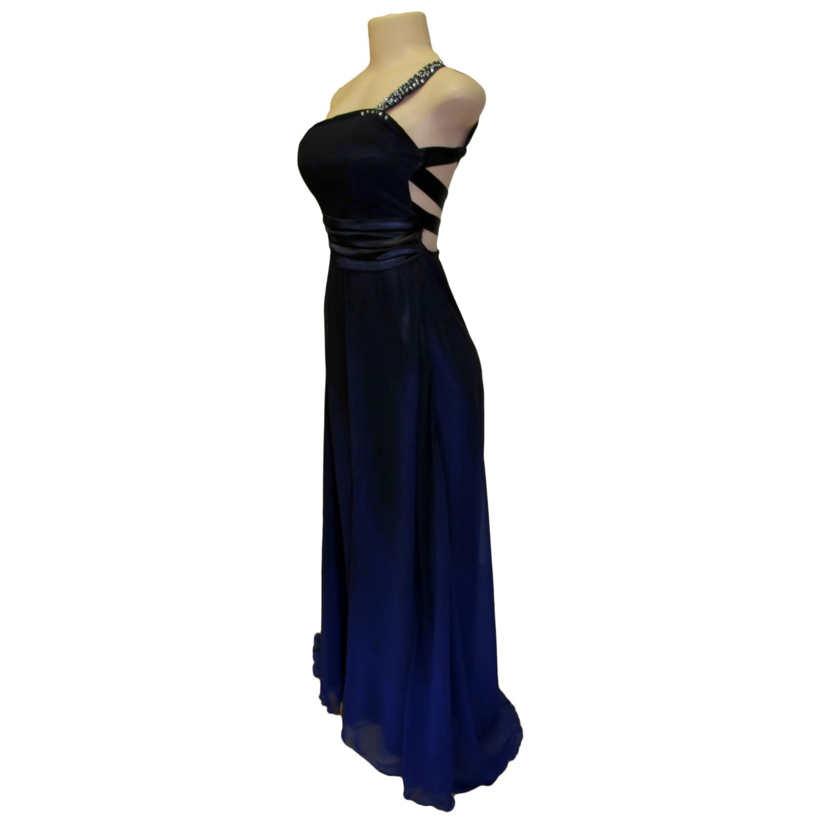 Black and royal blue flowy prom dress with a wide waist band 6 black and royal blue flowy prom dress with a wide waist band, an open back with strap design. With a train and silver detailing.