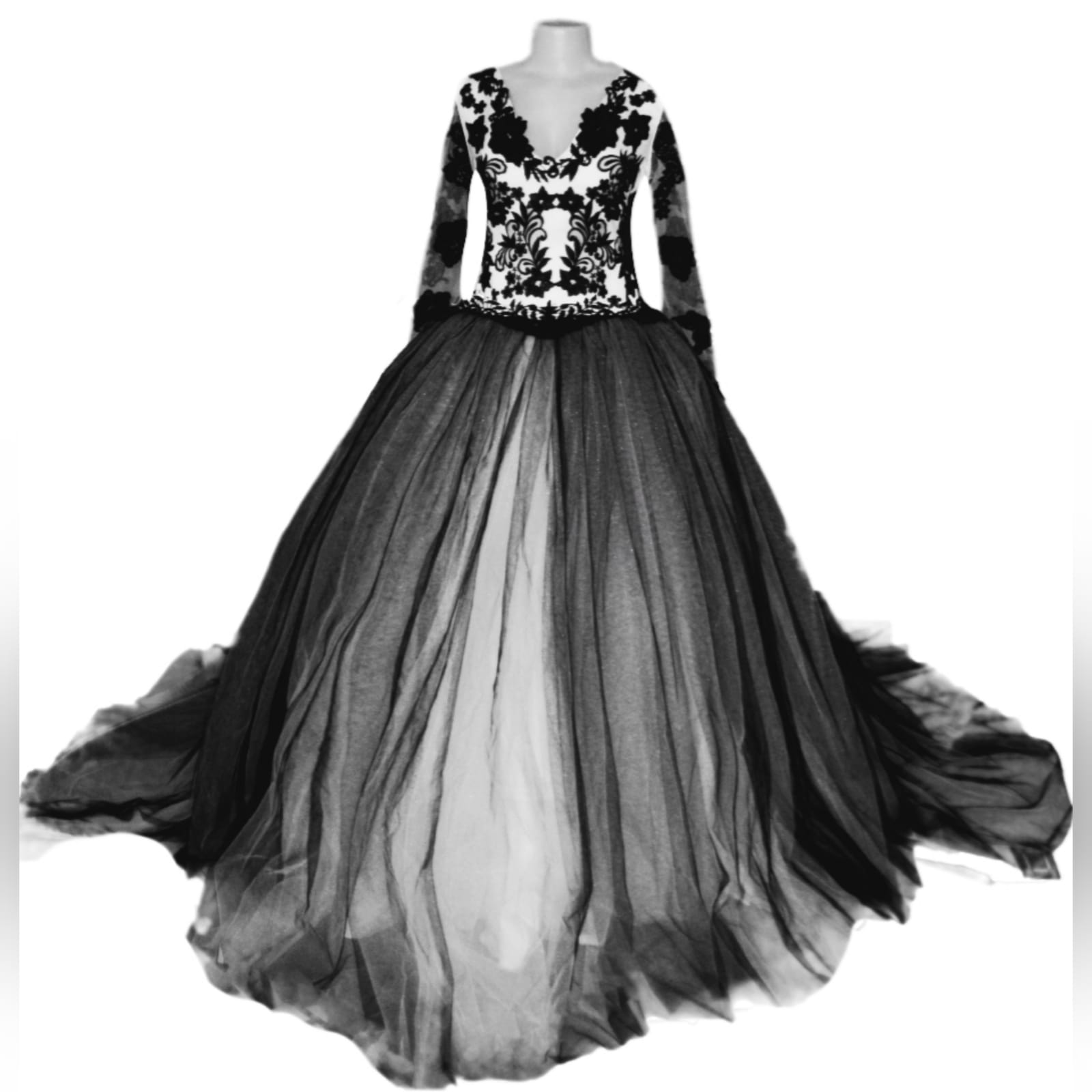 Black and white plus size ball gown wedding dress 1 black and white plus size ball gown wedding dress, bodice in white, detailed with black lace. Illusion lace long sleeves with a poofy black and white tulle bottom. With a train.
