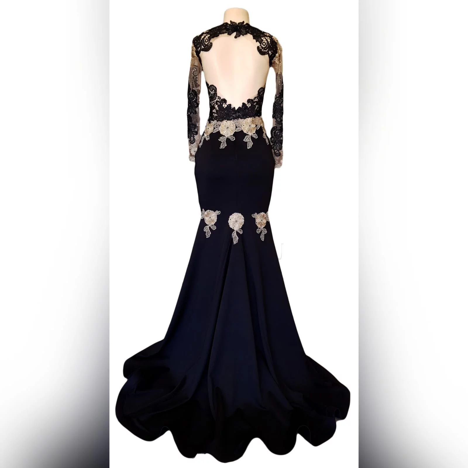 Black & gold soft mermaid prom dress 7 black & gold soft mermaid prom dress with an illusion lace bodice and long sleeves. With an open back and a train. Lace detailed with beads.