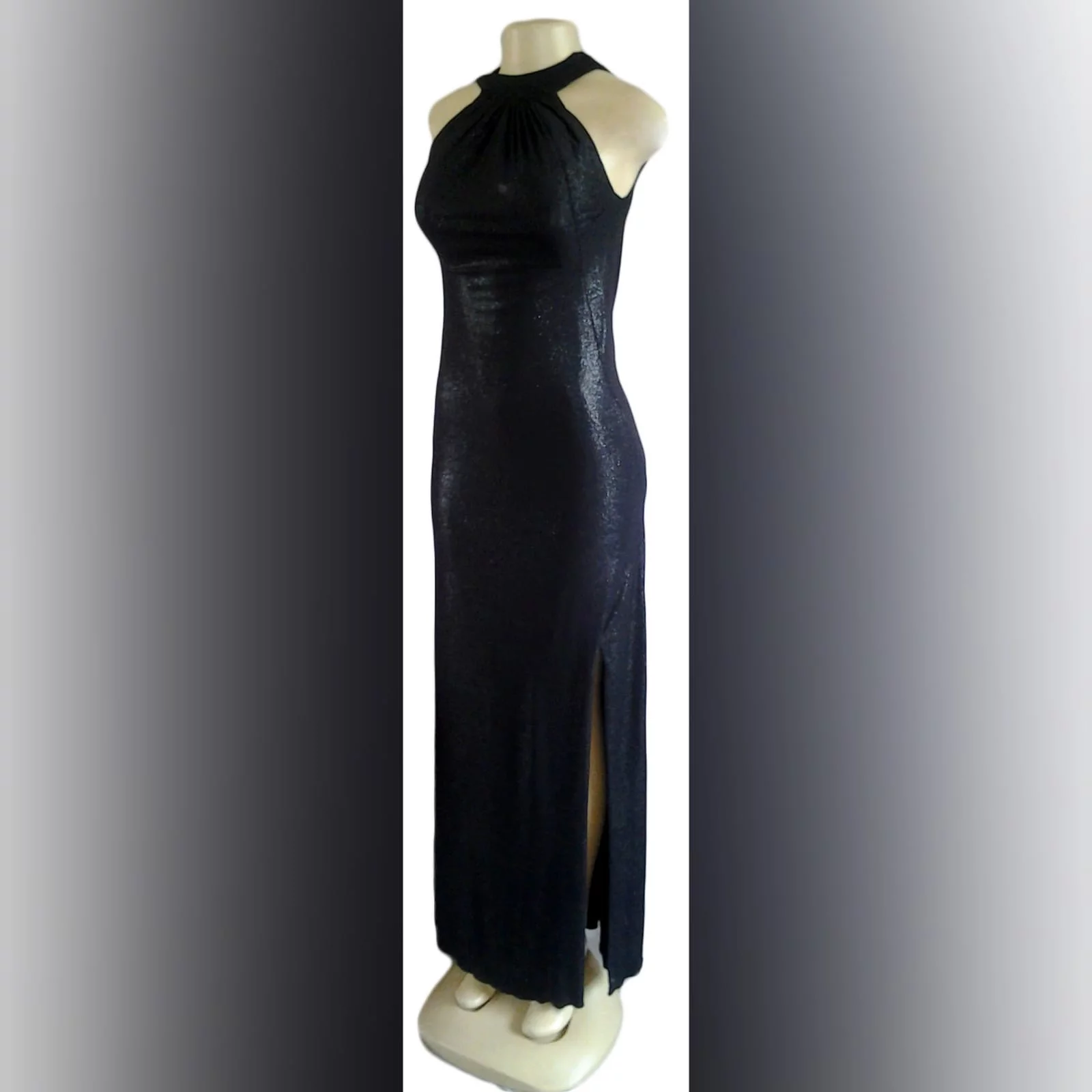 Black shimmer fitted long evening dress 2 black shimmer fitted long evening dress, with a gathered neckline and a low open cowl neck at the back, with a side slit.