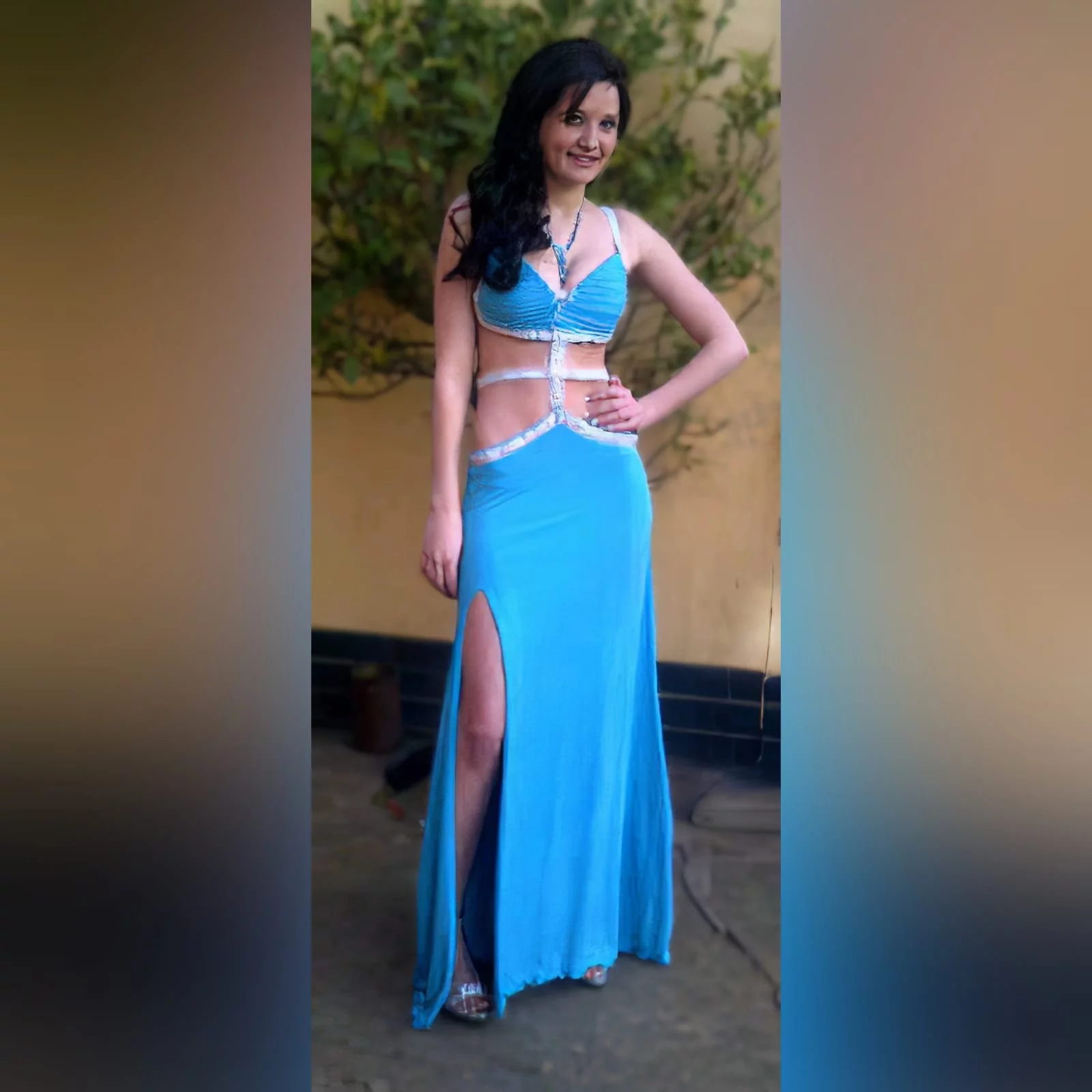 Blue and silver sexy long matric farewell dress with tummy and back open 1 blue and silver sexy long matric farewell dress with tummy and back open, with strap detail. With a slit, and a train.