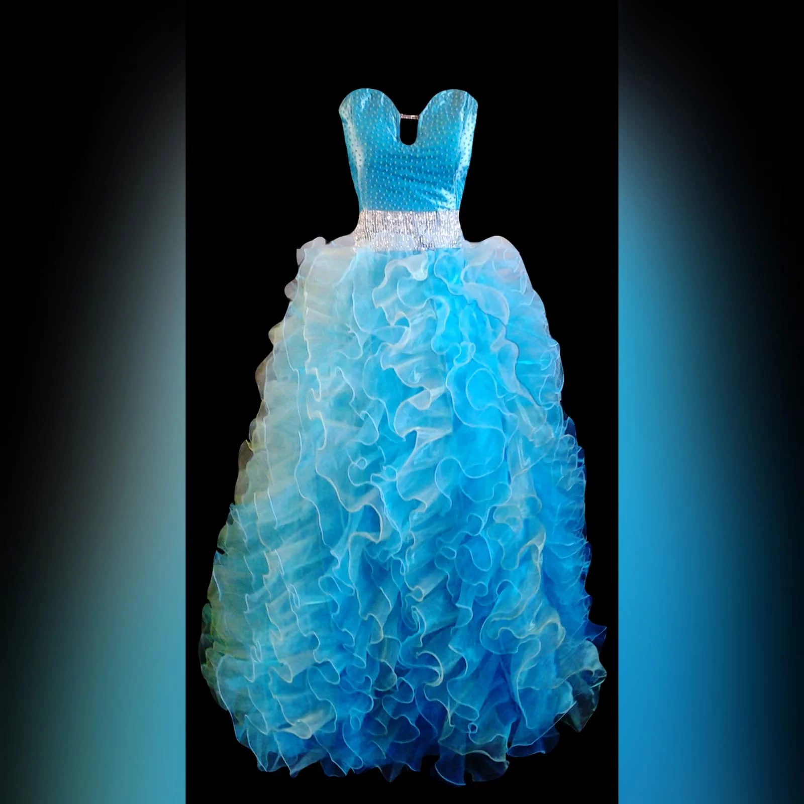 Blue ball gown for a matric farewell night 6 blue frilled ballgown for a matric farewell night. Bodice with scattered beads, with a wide silver belt, bottom fully frilled.