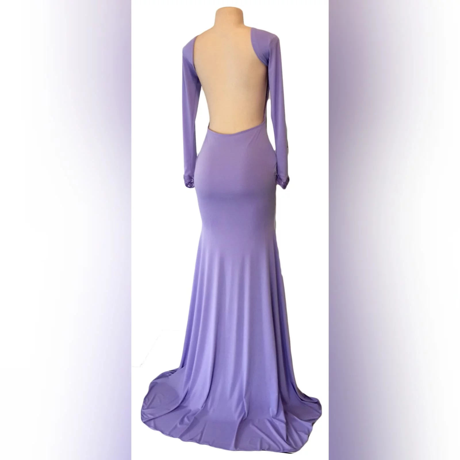 Body fitting lilac soft mermaid matric farewell dress and a jewel neckline 6 body fitting lilac soft memaid matric farewell dress and a jewel neckline. Low open square back. With a train and long sleeves. Sleeves finished with lace.