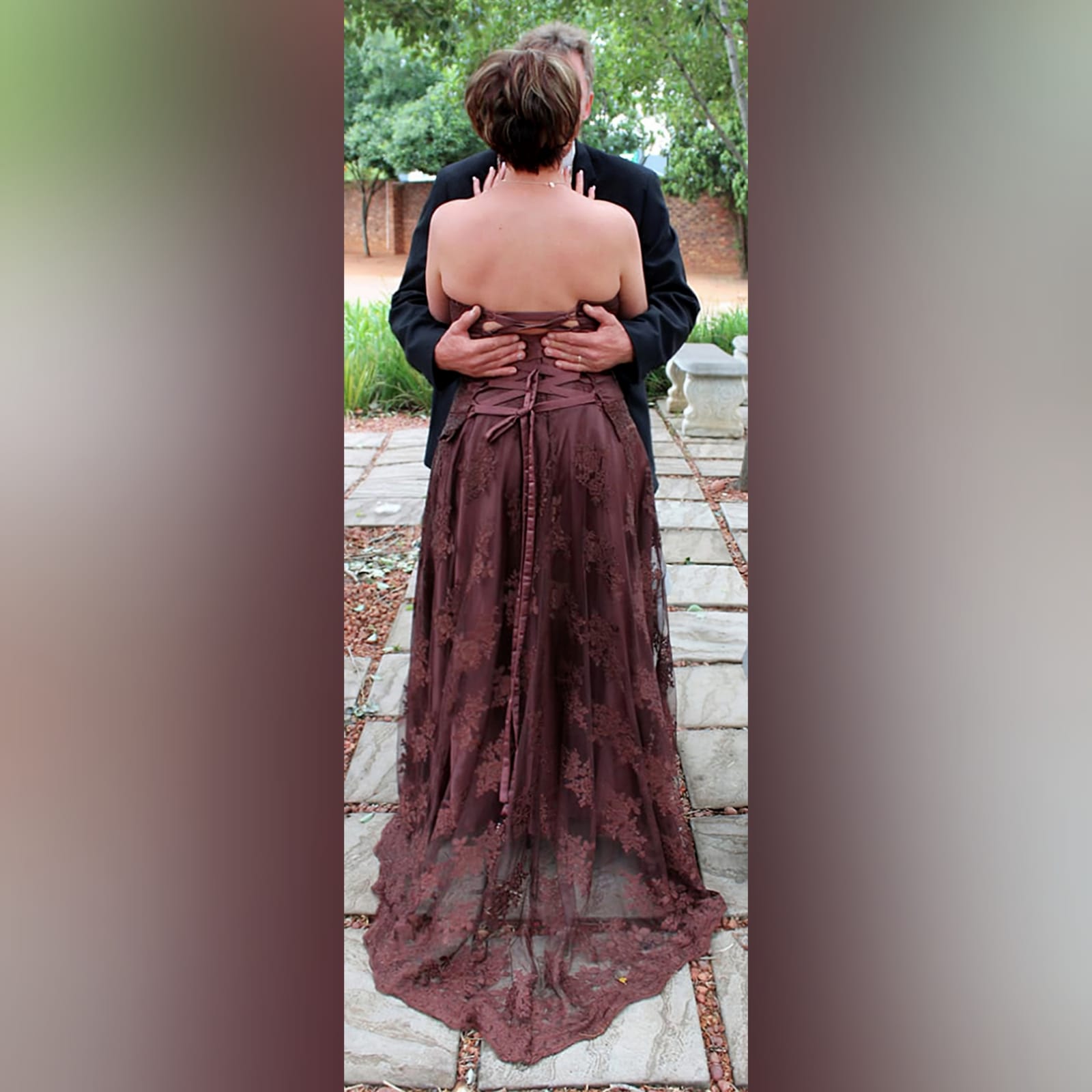 Brown 2 piece lace wedding dress 4 brown 2 piece lace wedding dress. With a flowy skirt, with train. Boob tube corset top with a lace up back.