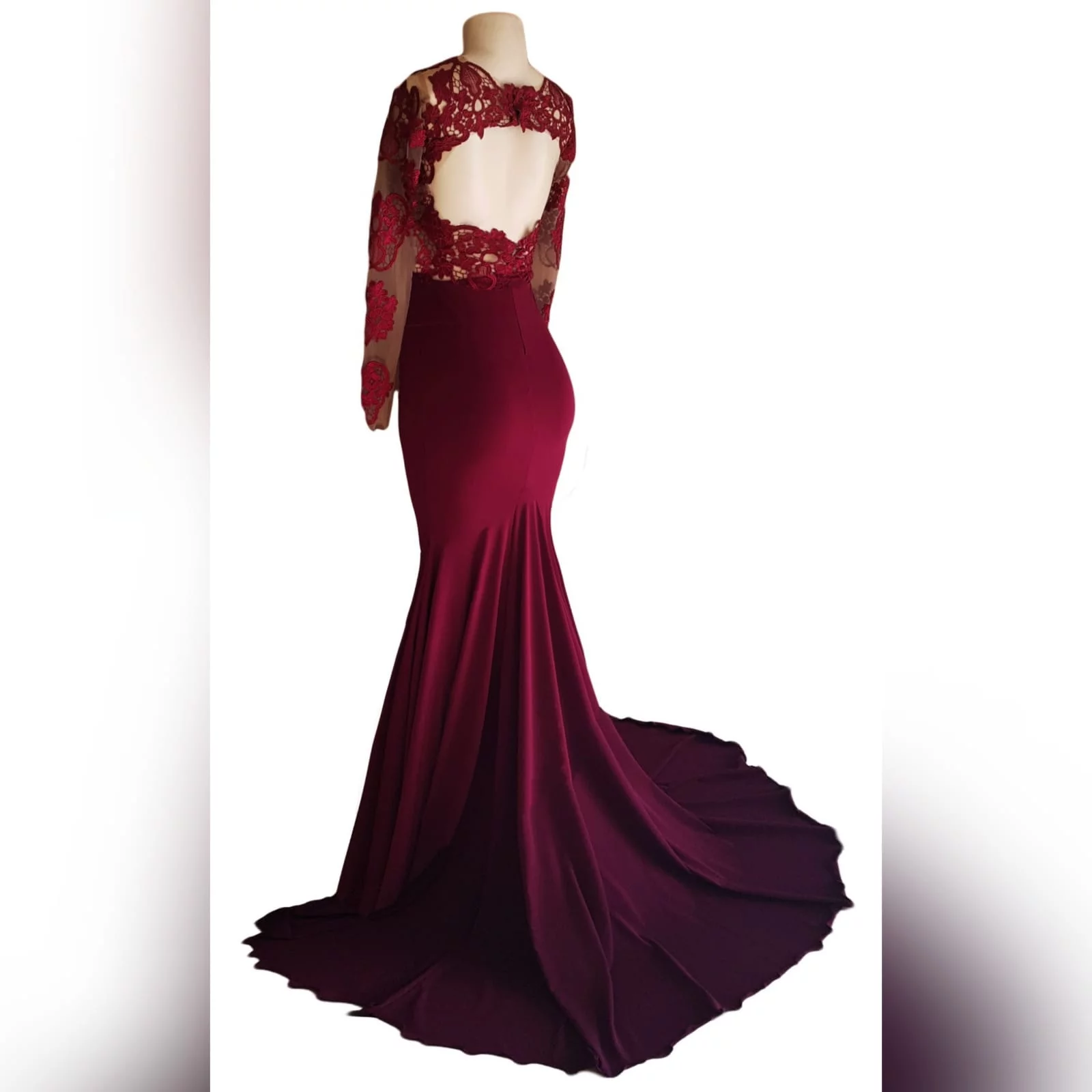 Burgundy soft mermaid illusion lace bodice prom dress 6 burgundy soft mermaid illusion lace bodice prom dress with a rounded open back with lace long sleeves and a train.