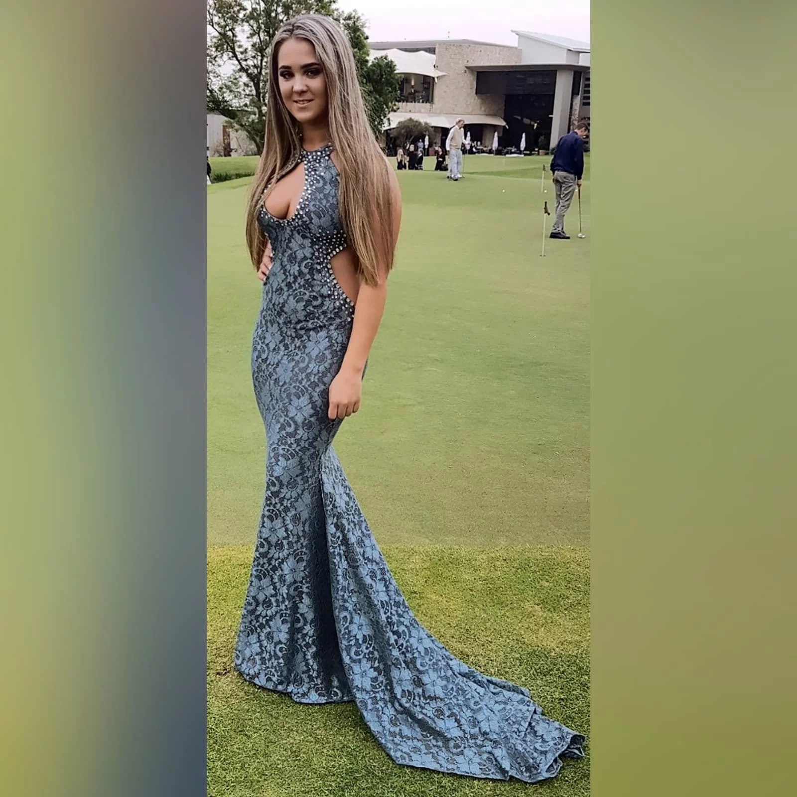 Choker grey fully laced long matric farewell dress 1 grey fully laced long matric farewell dress with a choker neckline and a cleavage opening and side tummy openings with a train. Detailed with silver beads.