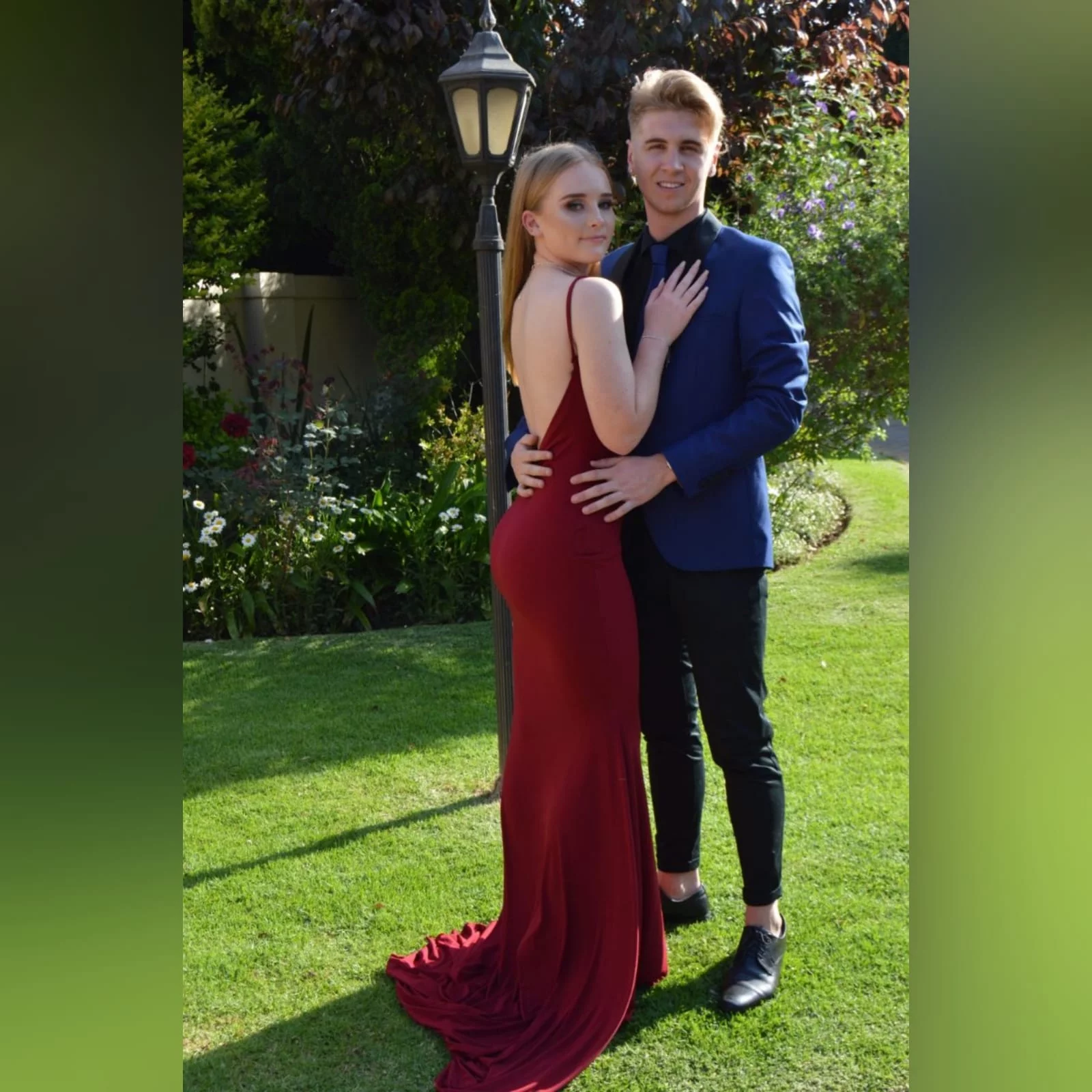 Deep red plunging neckline matric dance dress 2 deep red plunging neckline matric dance dress, low open back with thin should straps and a long train.