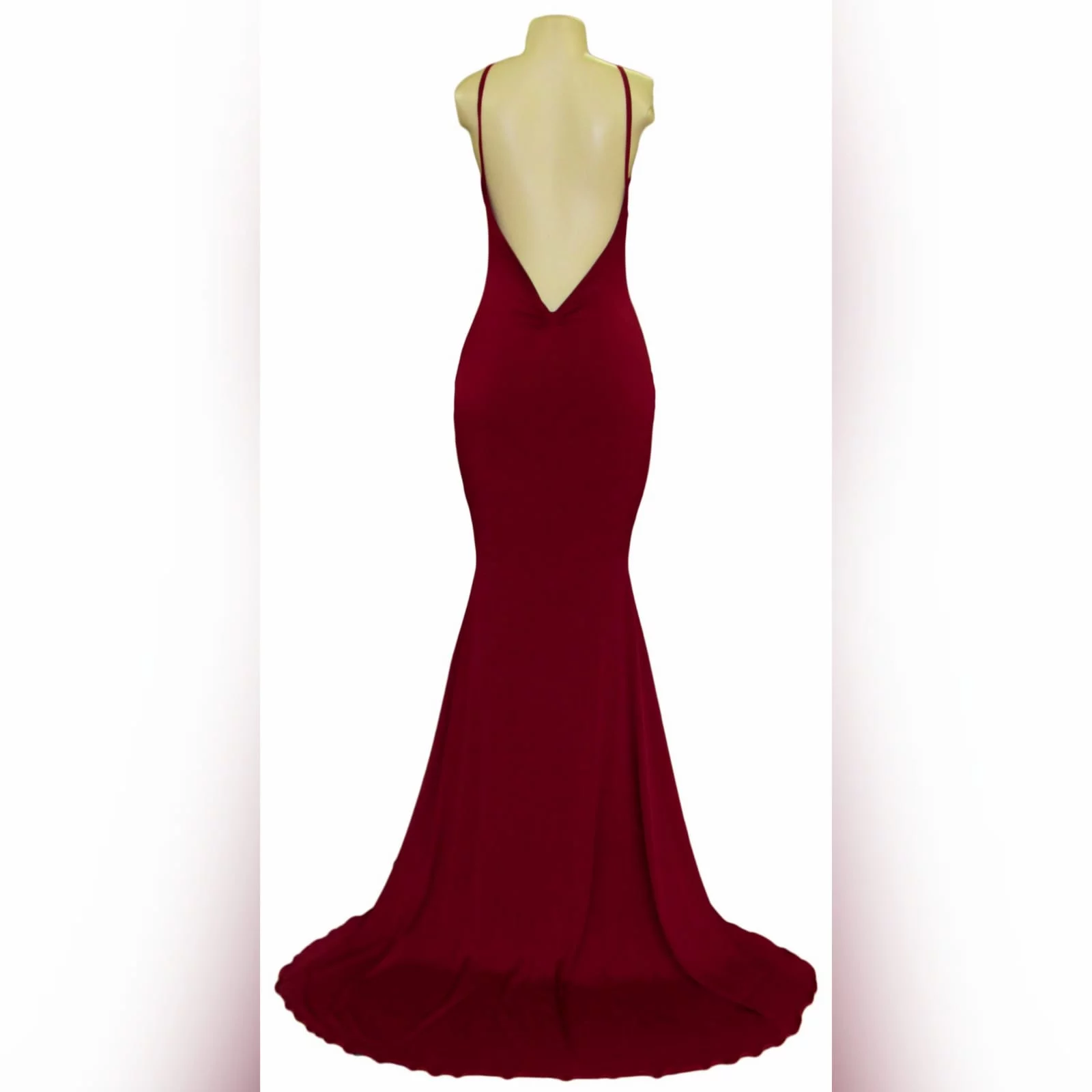 Deep red plunging neckline matric dance dress 11 deep red plunging neckline matric dance dress, low open back with thin should straps and a long train.