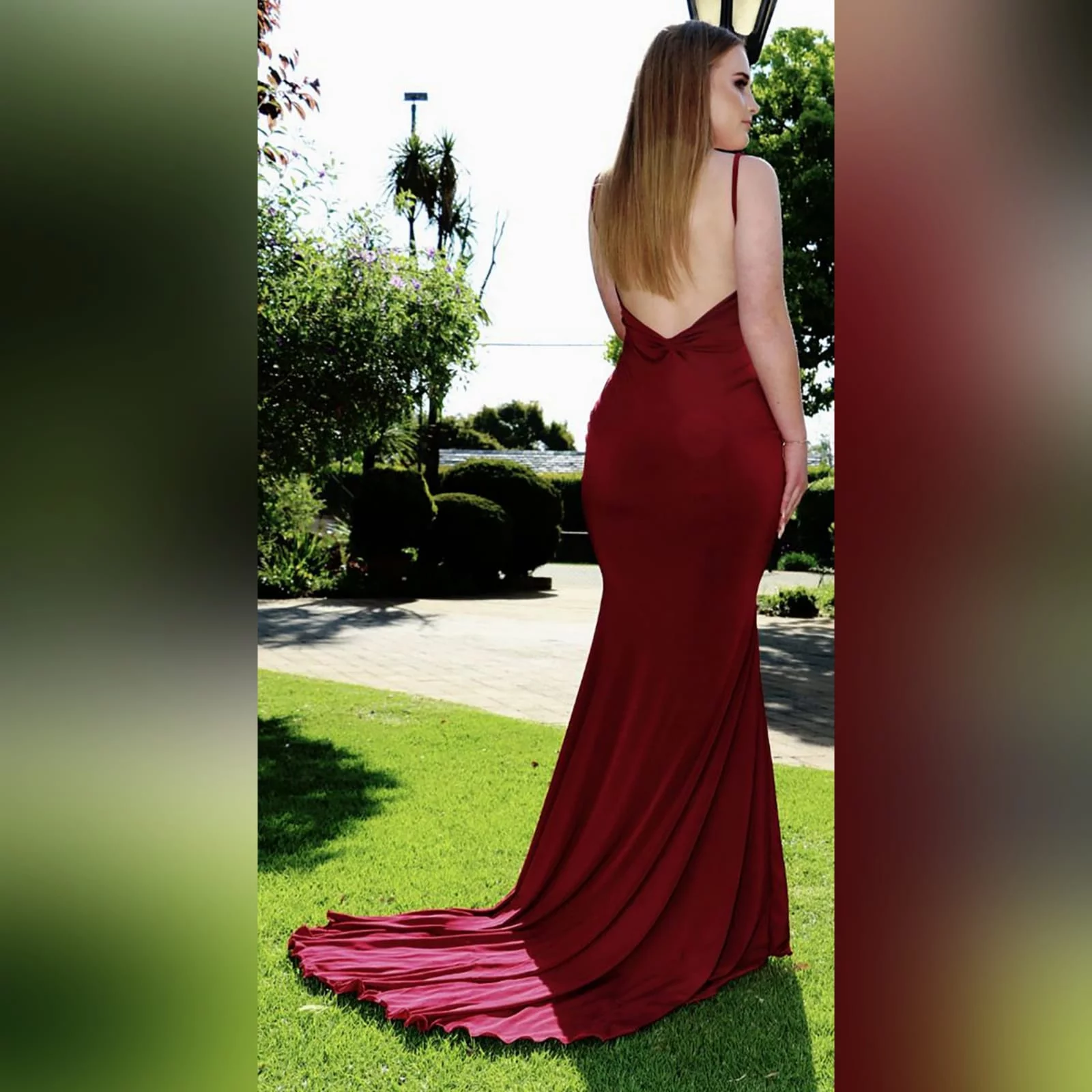 Deep red plunging neckline matric dance dress 5 deep red plunging neckline matric dance dress, low open back with thin should straps and a long train.