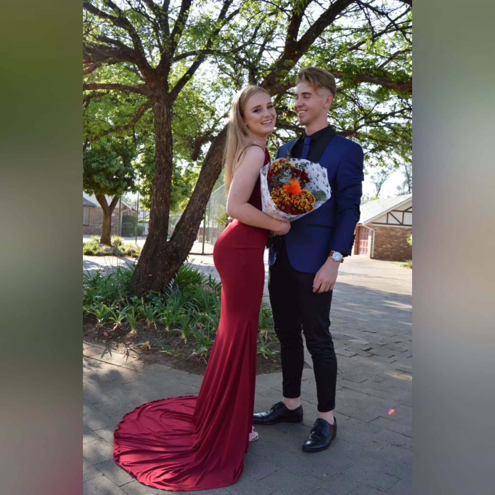 Deep red plunging neckline matric dance dress 8 deep red plunging neckline matric dance dress, low open back with thin should straps and a long train.