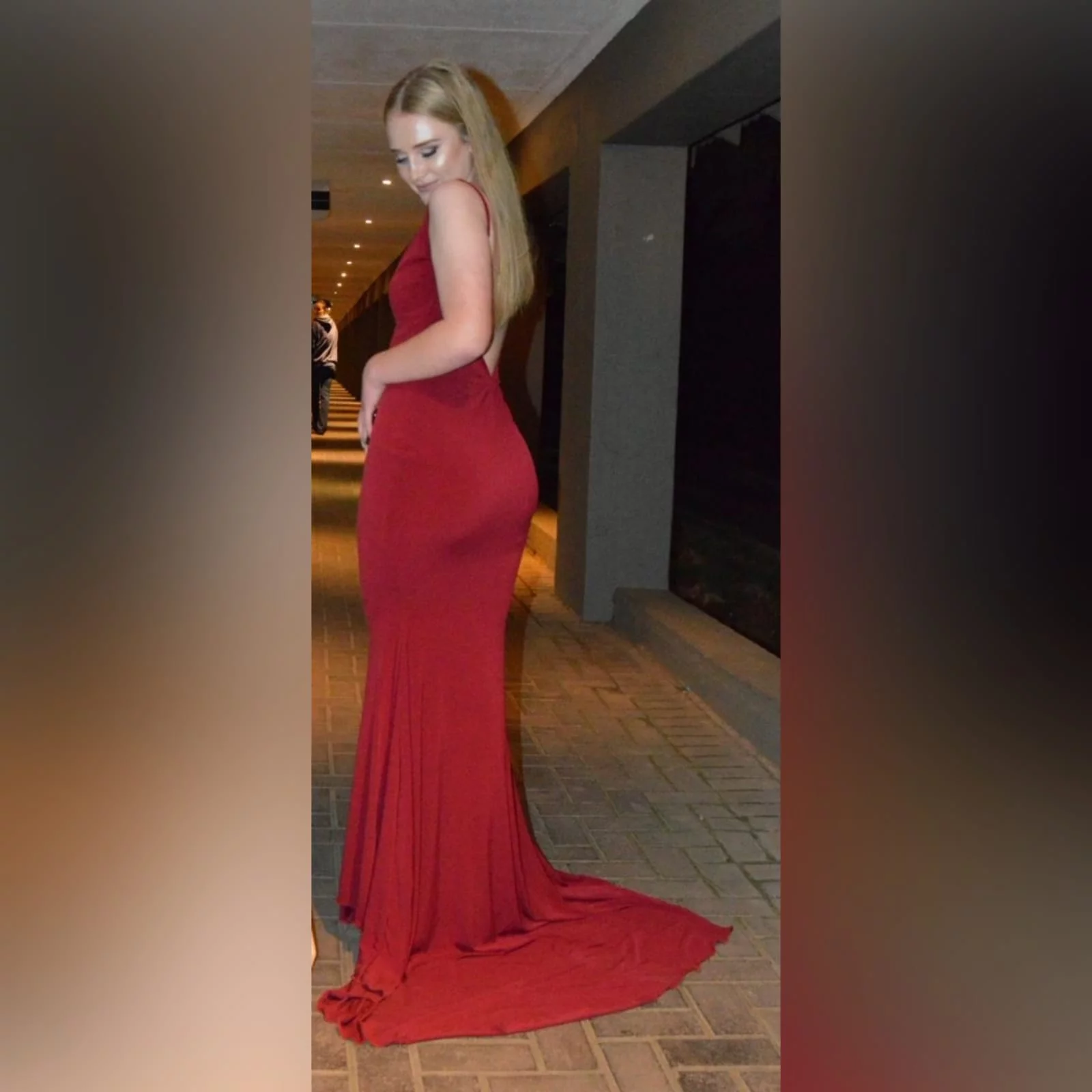 Deep red plunging neckline matric dance dress 9 deep red plunging neckline matric dance dress, low open back with thin should straps and a long train.