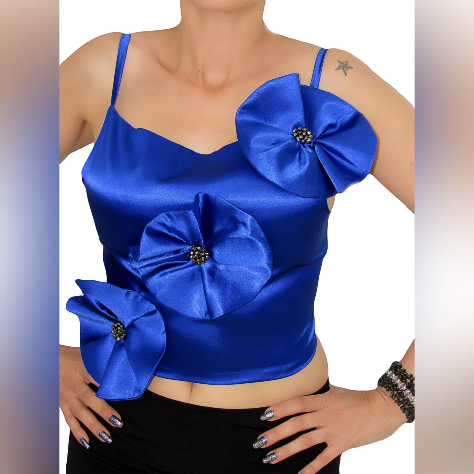 Elegant royal blue flower detail top 3 elegant royal blue flower detail top. Handmade top, a unique design made in several colours. Made in satin with a luxurious shine, perfect for a smart casual event, or even for a more formal event. Made with a lace-up open back to add a sexy touch to the top. And to adjust the fit accordingly.