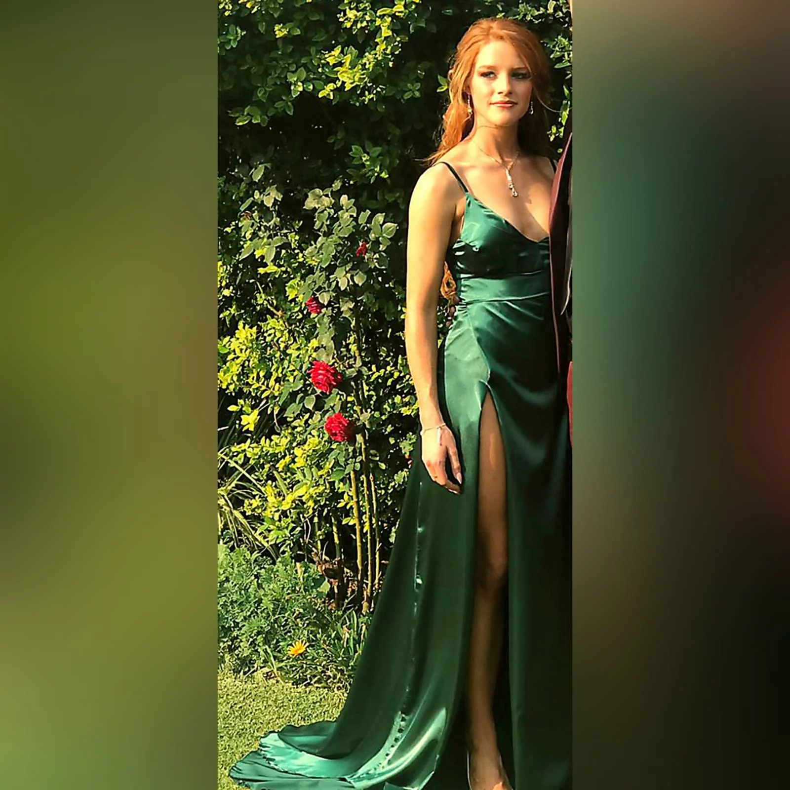 Emerald green long satin matric farewell dress 3 emerald green long satin matric farewell dress. With a high crossed slit and a train.