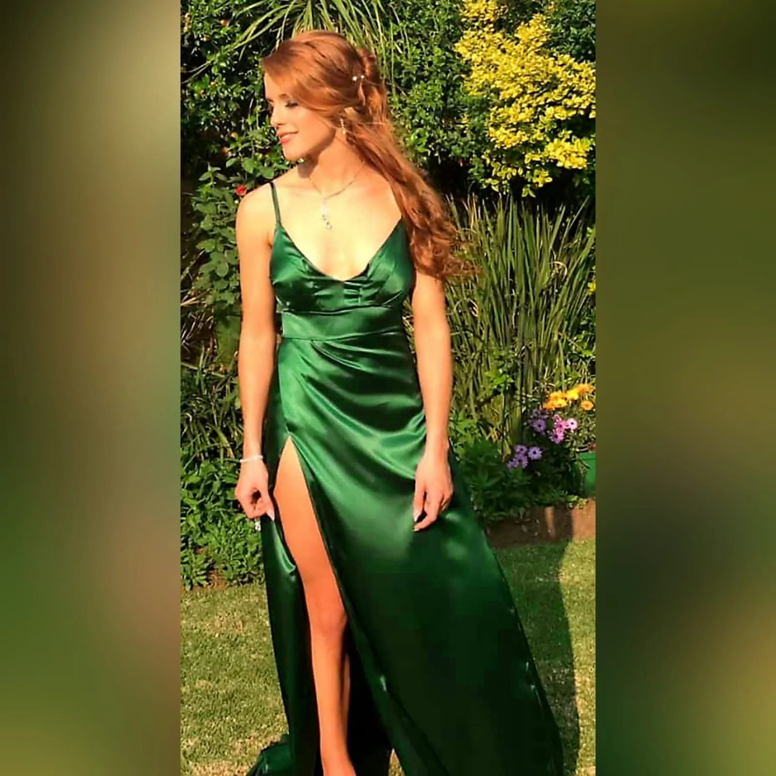 Emerald green long satin matric farewell dress 1 emerald green long satin matric farewell dress. With a high crossed slit and a train.