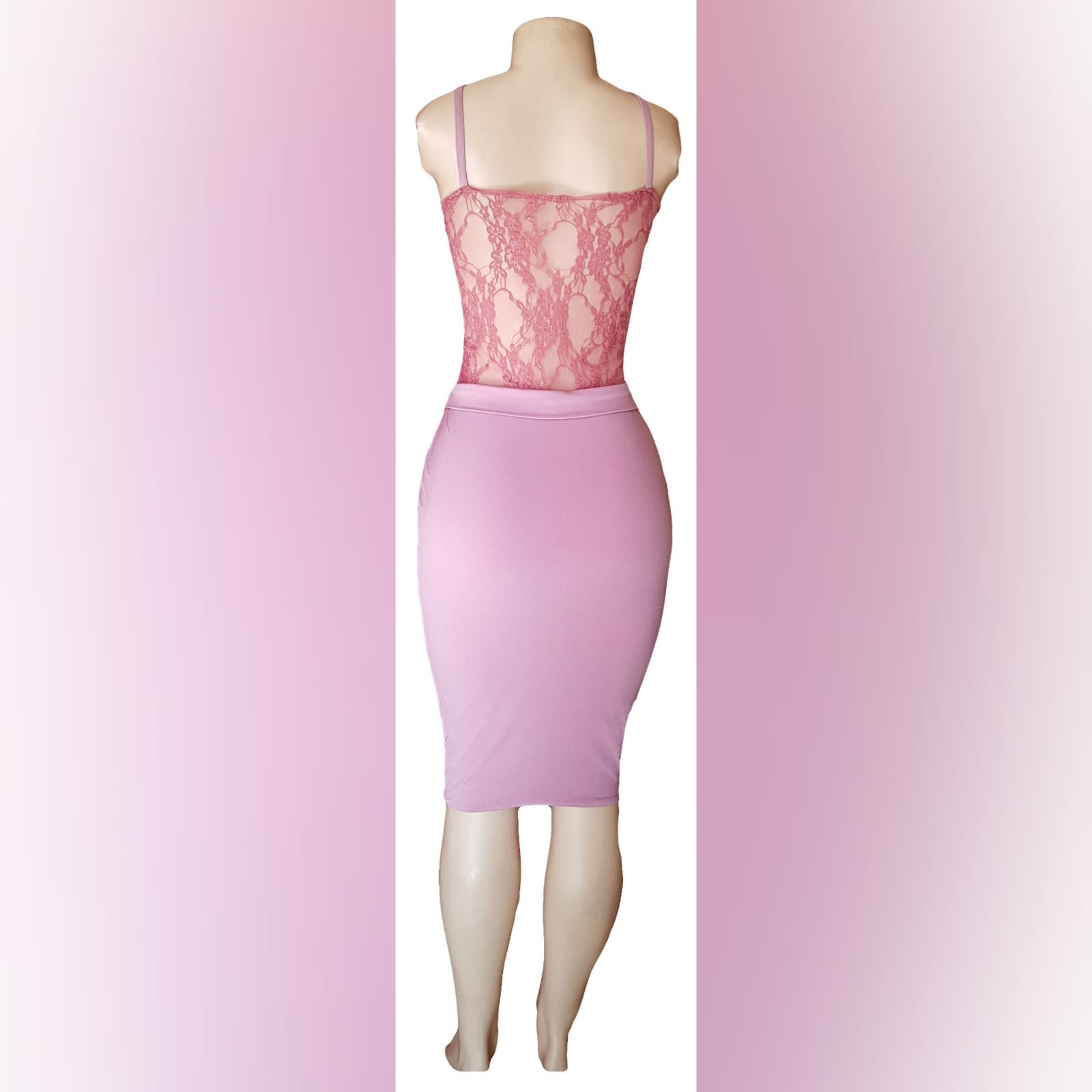 Knee length pink fitted smart casual dress 3 knee length pink fitted smart casual dress with a sheer lace bodice with a waistband and shoulder straps.
