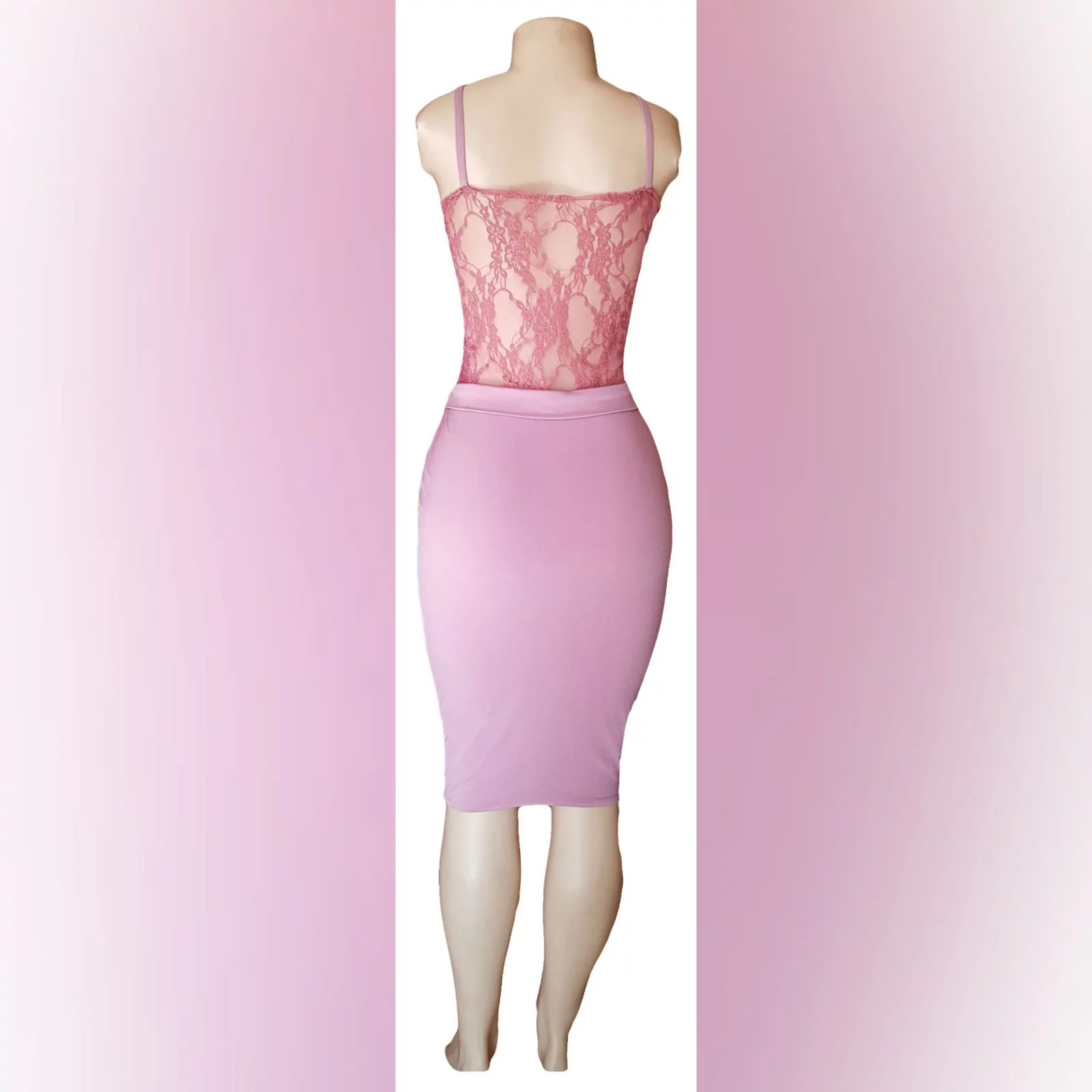 Knee length pink fitted smart casual dress 3 knee length pink fitted smart casual dress with a sheer lace bodice with a waistband and shoulder straps.