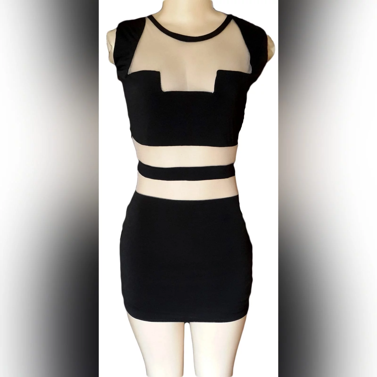 Mini black smart casual dress 1 mini black smart casual dress with see through tummy design and funky neckline
