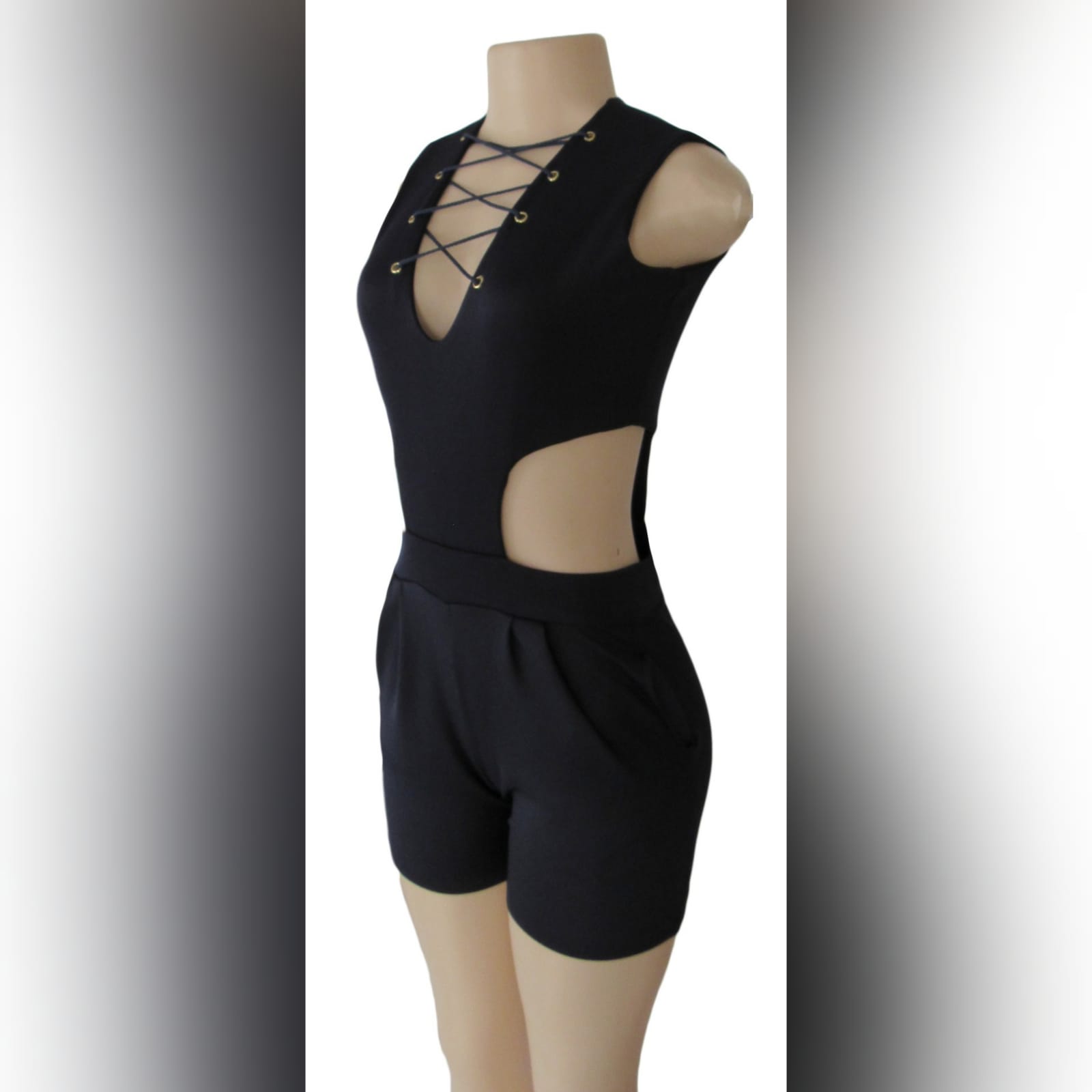 Navy blue smart casual bodysuit 1 navy blue smart casual bodysuit, with side tummy openings, v neckline detailed with lace-up detail, and back with a gold zipper.