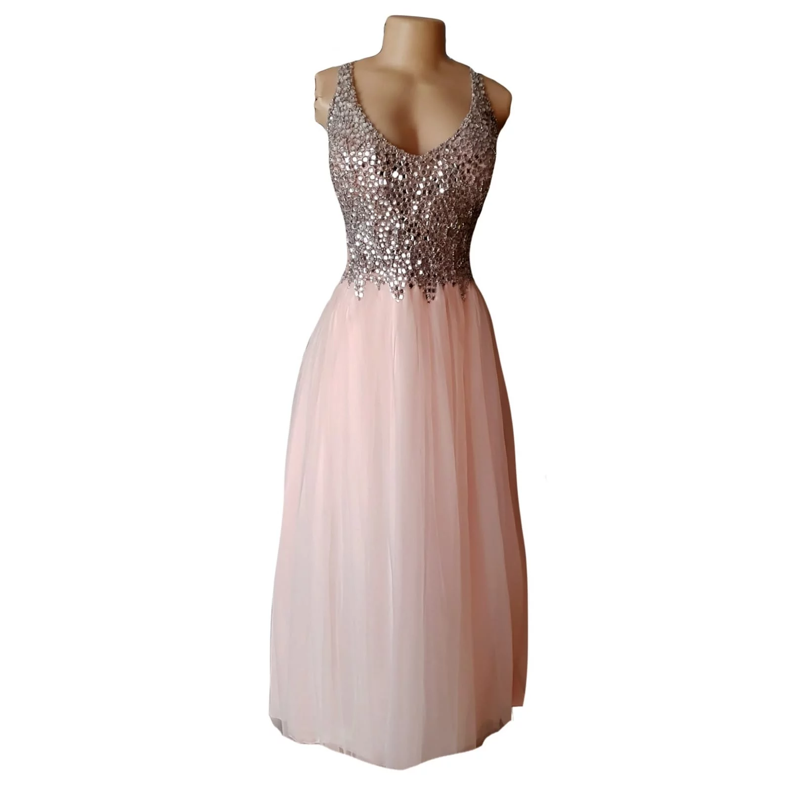 Pink nude and silver long plus size prom dress 5 pink nude and silver long plus size prom dress with a beaded bodice and a lace up back and a tulle bottom.