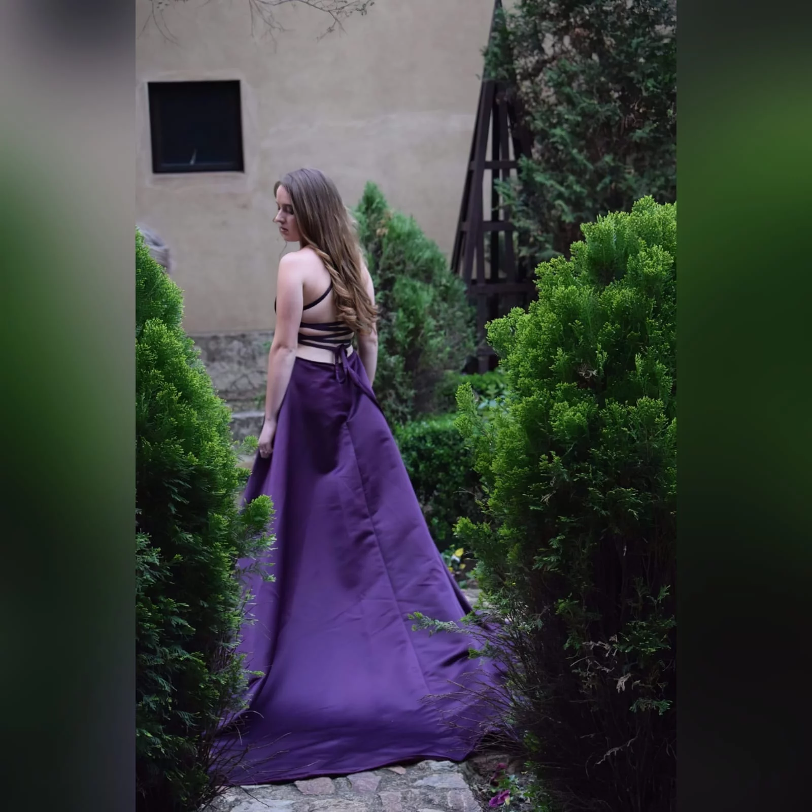 Plum long flowy prom dress with a plunging neckline 9 plum long flowy prom dress with a plunging neckline and a lace up open back with a slit and train.