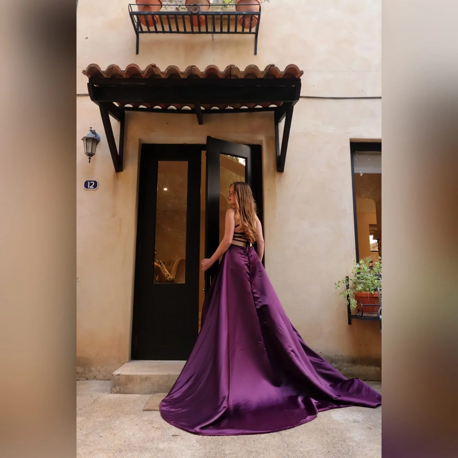 Plum long flowy prom dress with a plunging neckline 5 plum long flowy prom dress with a plunging neckline and a lace up open back with a slit and train.