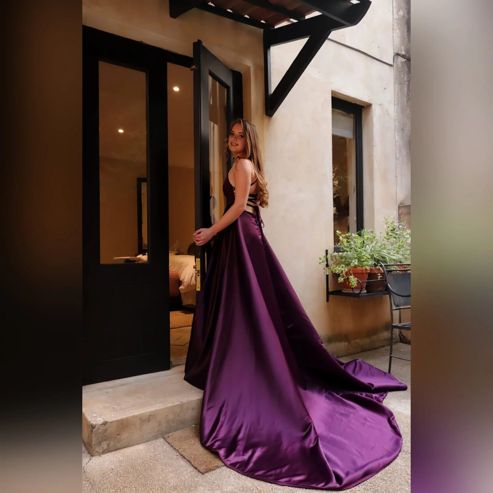 Plum long flowy prom dress with a plunging neckline 1 plum long flowy prom dress with a plunging neckline and a lace up open back with a slit and train.