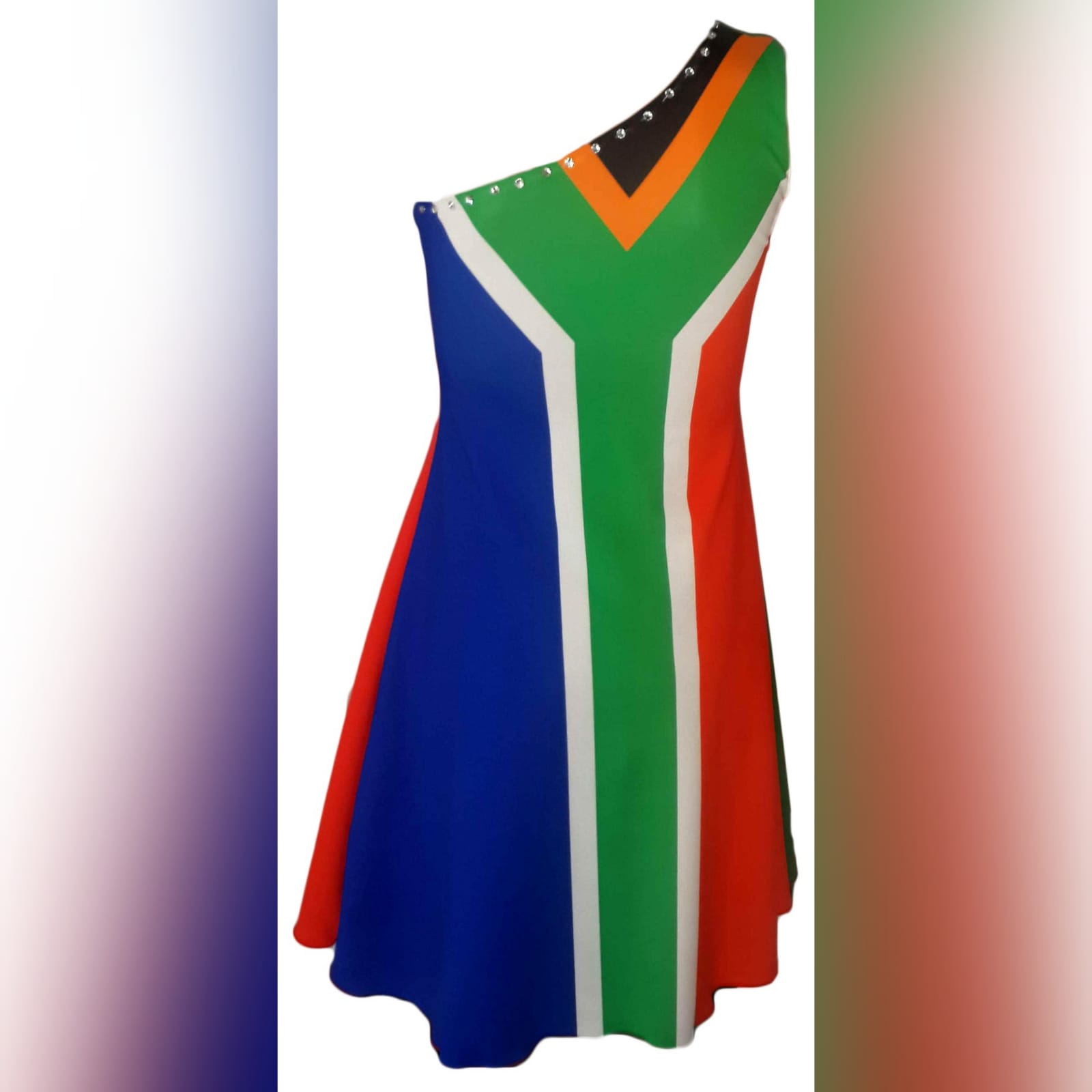 Portuguese flag and south african flag dress 7 single shoulder dress with the portuguese flag in the front and the south african flag at the back. Bead detailing on the front and the back. Worn for heritage day. She won a prize for best dressed.