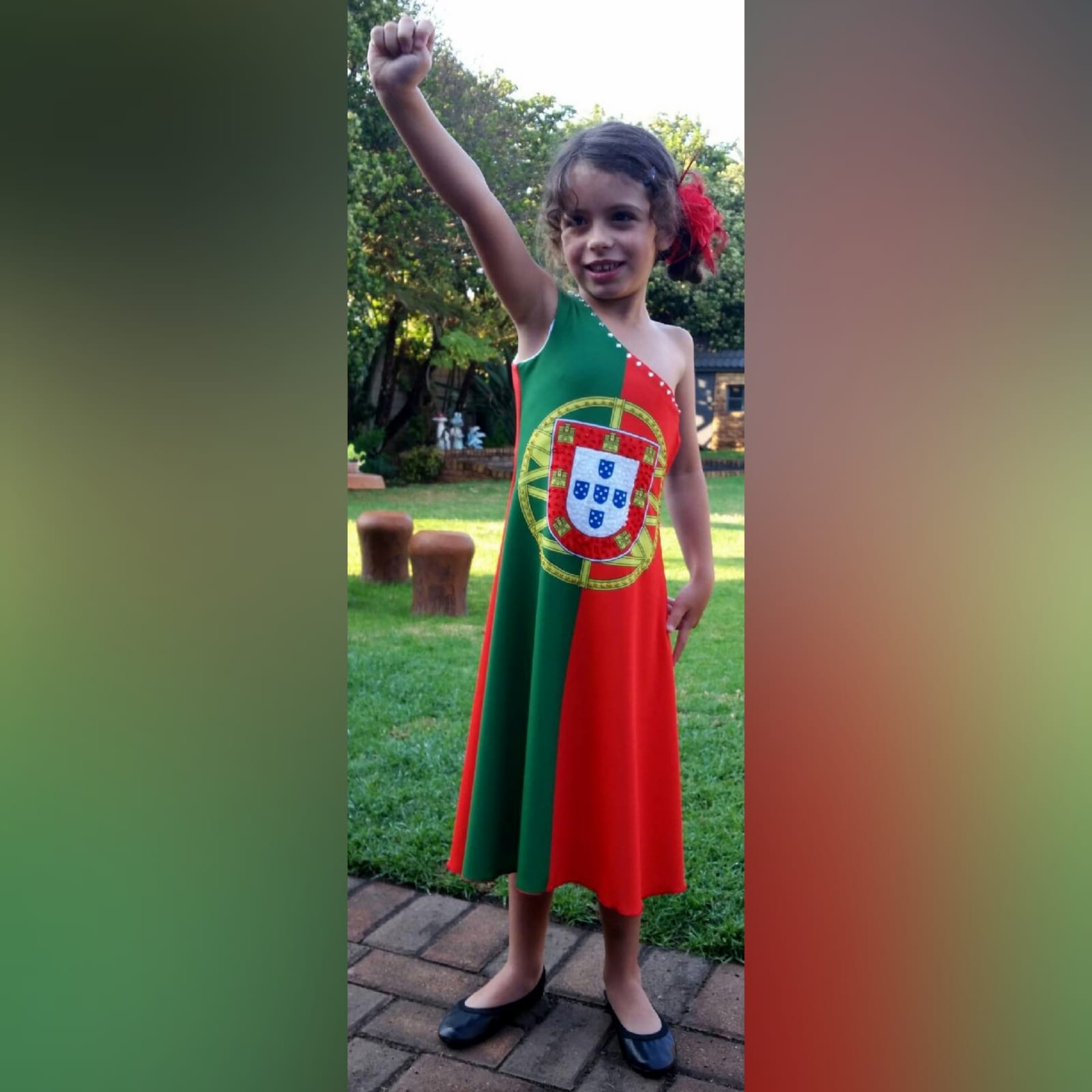 Portuguese flag and south african flag dress 1 single shoulder dress with the portuguese flag in the front and the south african flag at the back. Bead detailing on the front and the back. Worn for heritage day. She won a prize for best dressed.