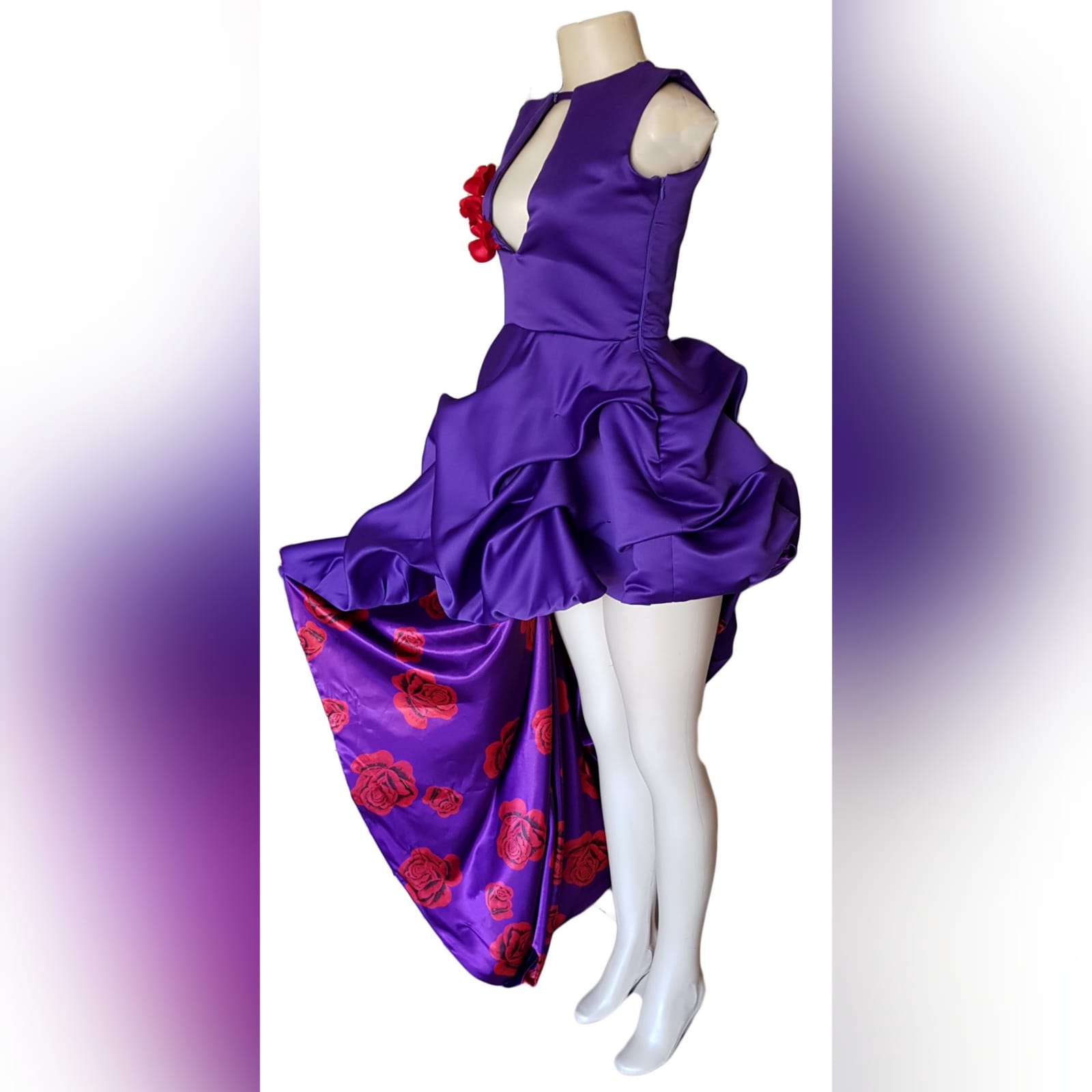 Purple and violet side high low prom dress 6 purple and violet side high low prom dress with a teardrop neckline and a diamond-shaped open back. With pull-ups lined with violet and red roses. Rose bust details.