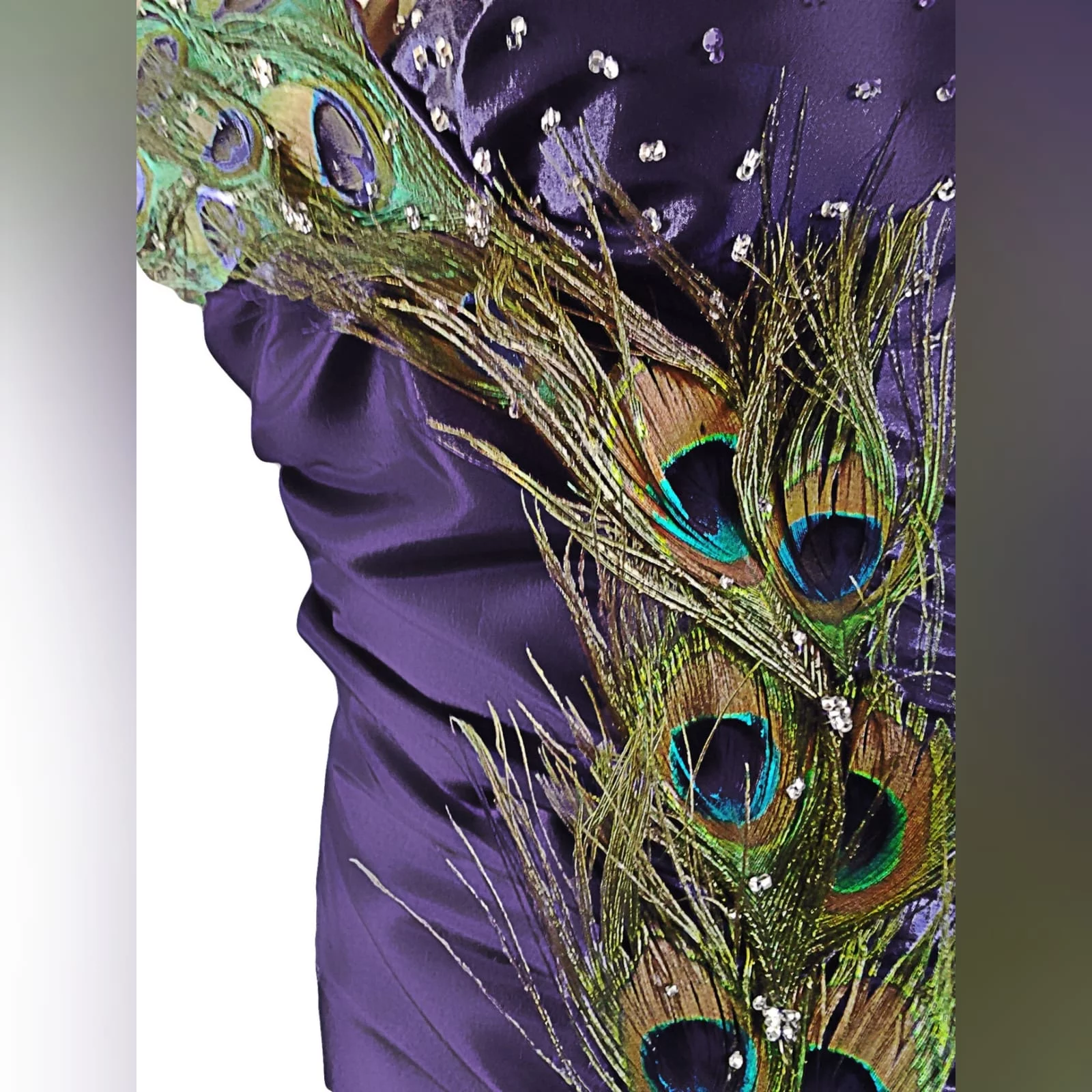 Purple peacock prom dance dress 5 purple prom dance dress detailed with peacock feathers and silver beads, with a slit, halter neck and matching hair accessory.