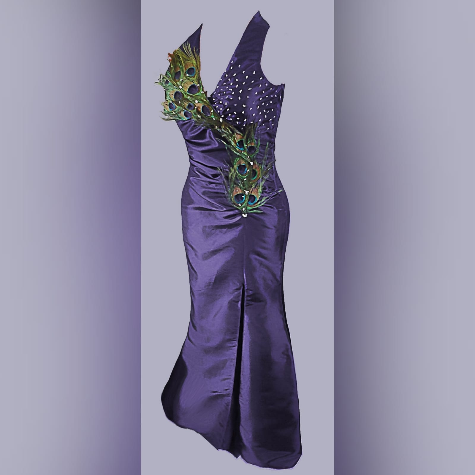 Purple peacock prom dance dress 6 purple prom dance dress detailed with peacock feathers and silver beads, with a slit, halter neck and matching hair accessory.