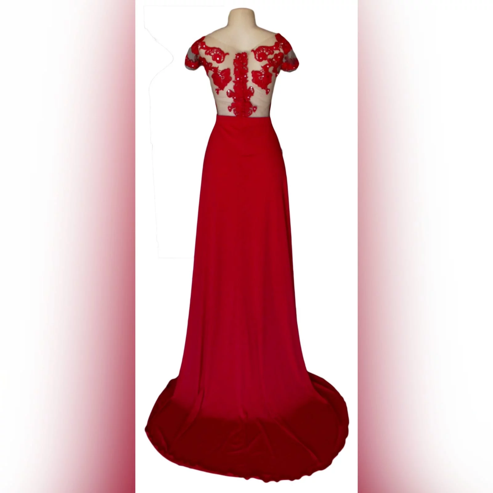 Red flowy lace bodice prom dress 3 red flowy lace bodice prom dress. With an illusion lace bodice detailed with silver beads and buttons. Evening dress with a slit and a train.