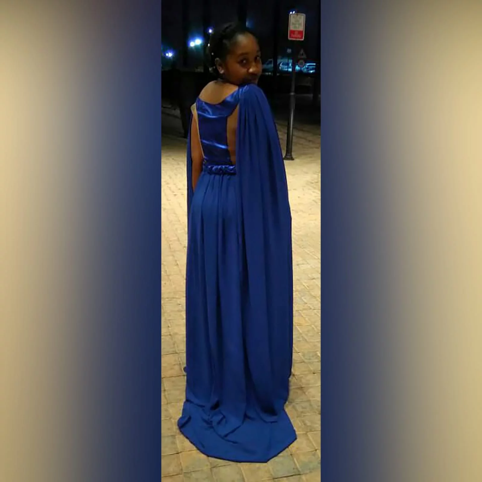 Royal blue flowy long matric dance dress 3 royal blue flowy long matric dance dress with a slit and a train. With 2 shoulder flowy chiffon detail. With a plaited belt and an illusion back.