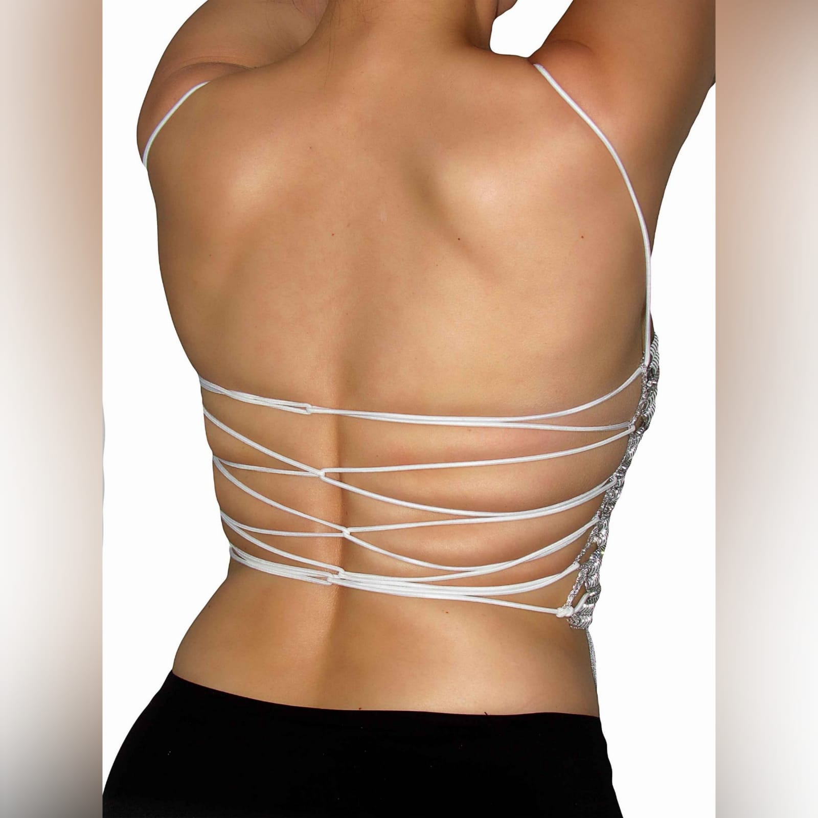 Silver striped diamante top 3 silver striped diamante top, a one of a kind. Handmade crop top with a fun tassel hemline. This open-back top has an elasticated white rope to create a lace-up, also helps to adjust to fit.