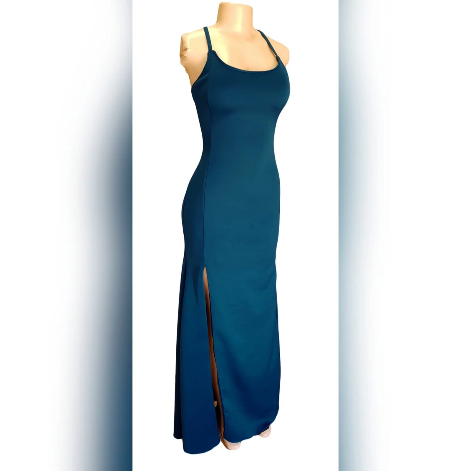 Teal long straight cut matric farewell dress with a slit 6 teal long straight cut matric farewell dress with a slit. Rounded neckline. V back with lace up detail.