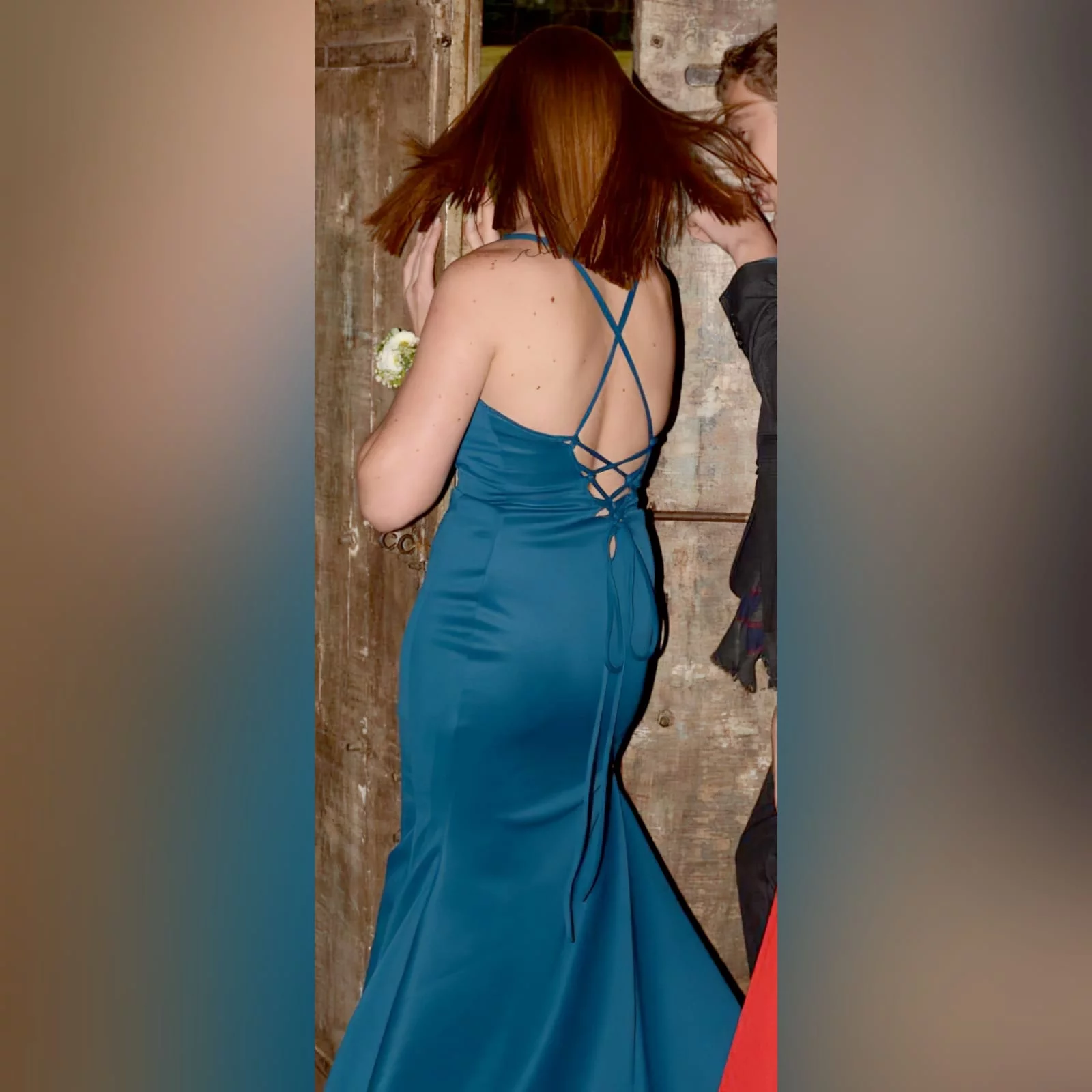 Teal long straight cut matric farewell dress with a slit 3 teal long straight cut matric farewell dress with a slit. Rounded neckline. V back with lace up detail.