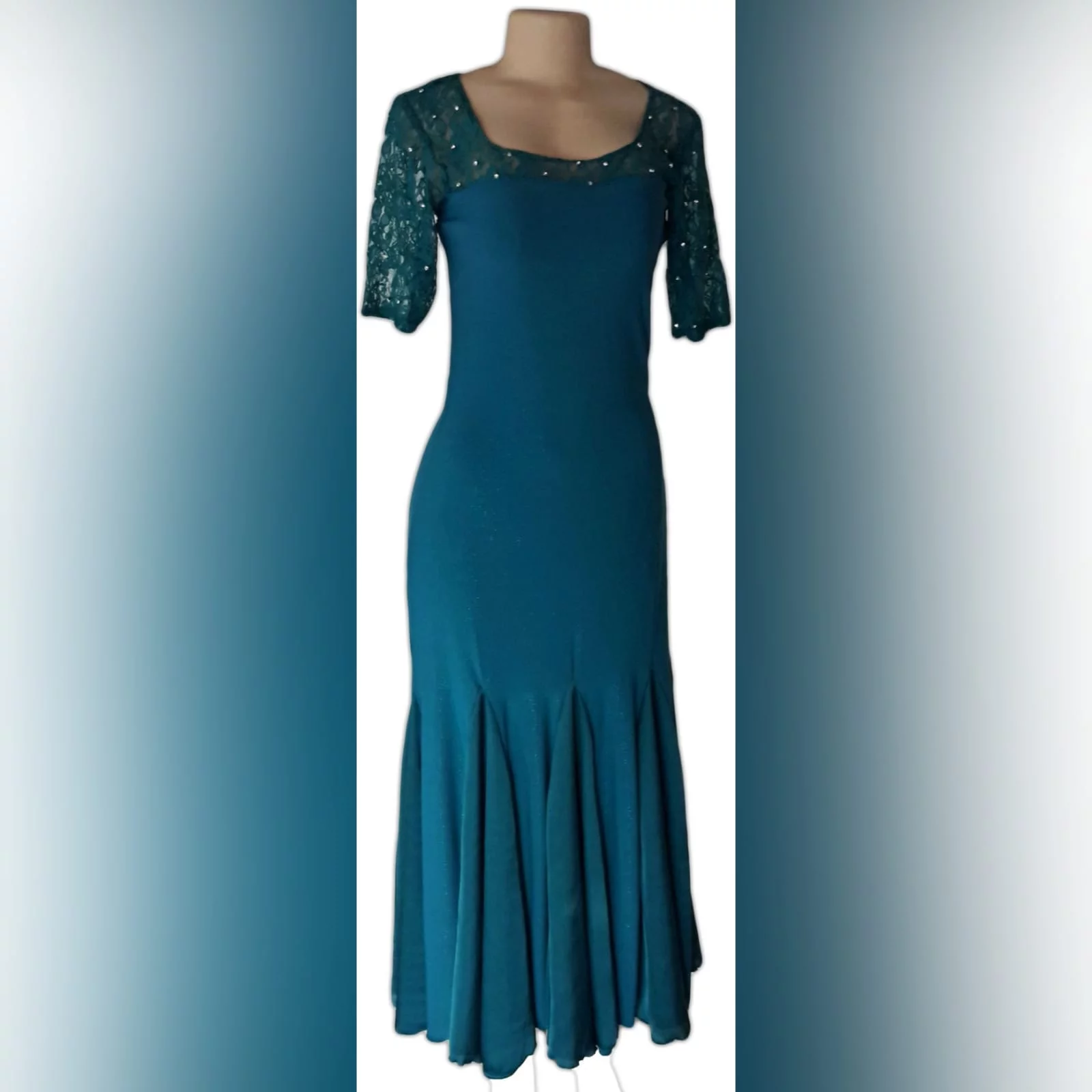 Turquoise green long party dress 4 turquoise green long party dress, fitted till hip then it flows, with a lace neckline scattered with a few beads