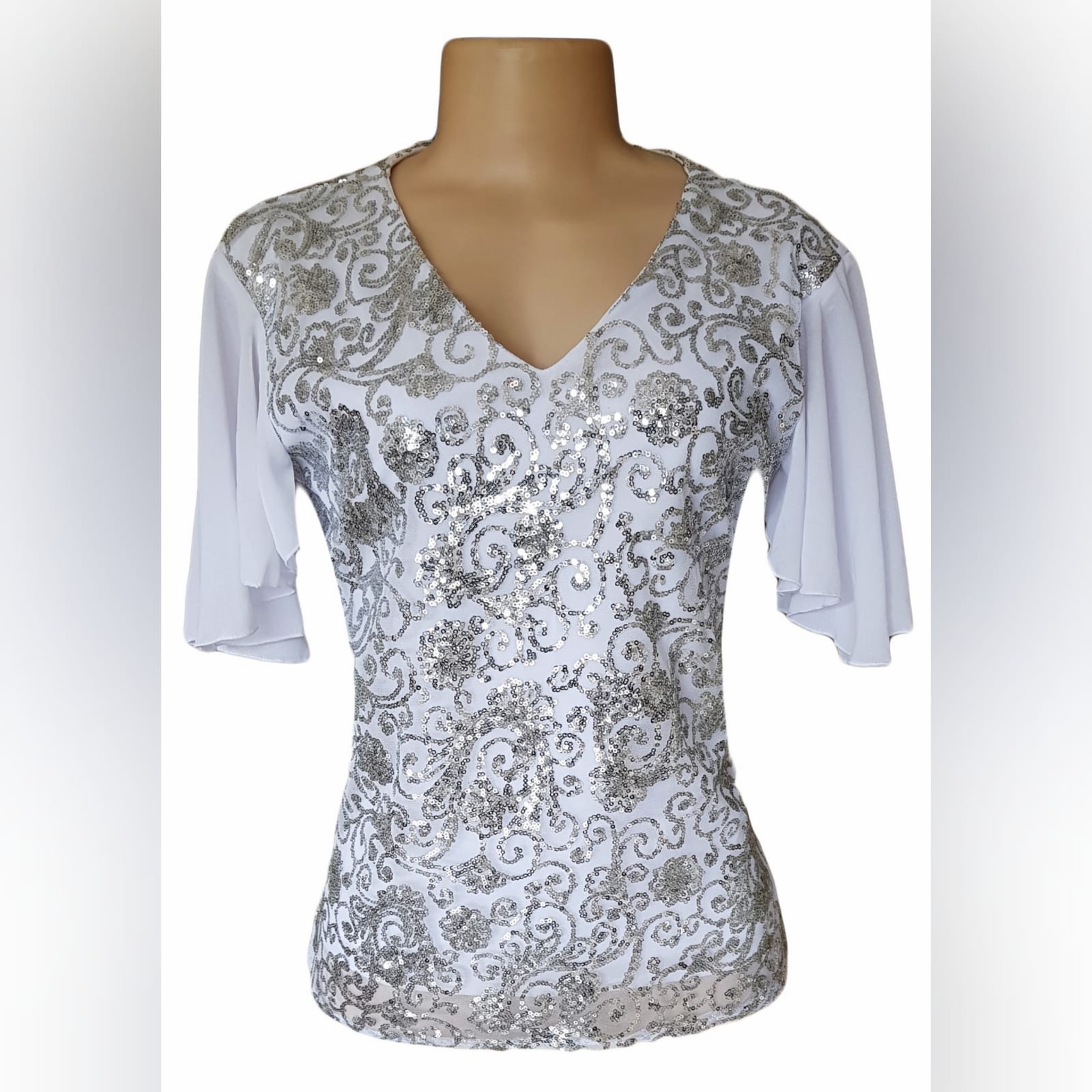 White patterned sequins smart casual top 1 white patterned sequins smart casual top with a v neckline and short chiffon flowy sleeves