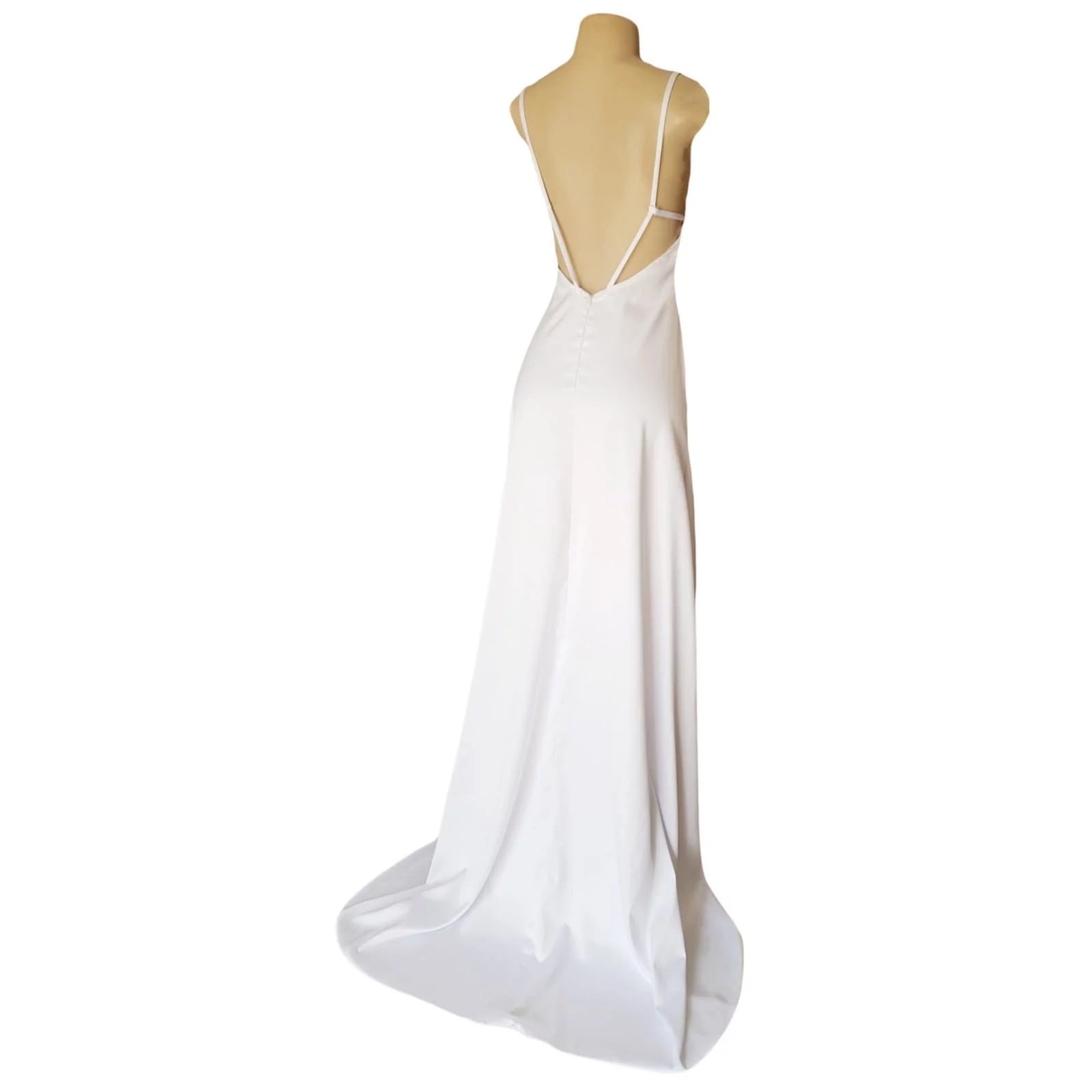 White satin long prom dress with a low open back 6 white satin long prom dress with a low open back, with strap detail. Straight neckline, 2 slits and a train.
