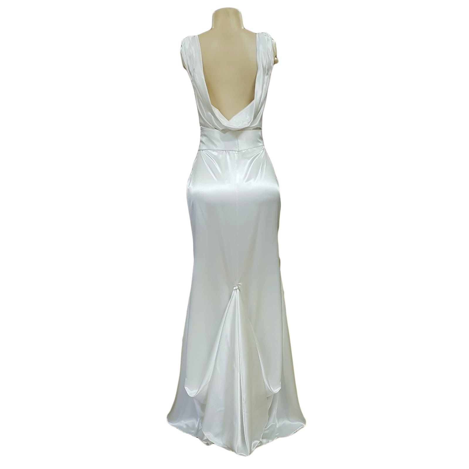 White satin soft mermaid wedding dress with silver belt detail 5 white satin soft mermaid wedding dress, cross busted neckline, open cowl neck back. Angled belt with diamante detail. Train with train hookup.