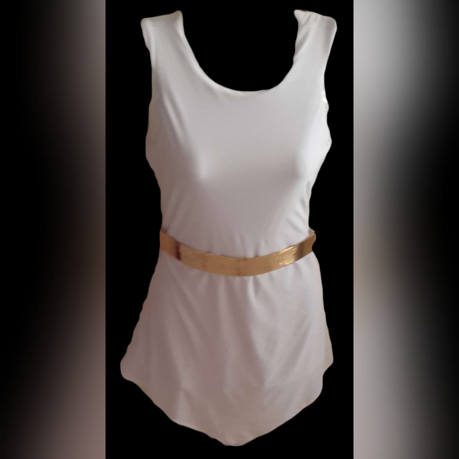 White short smart casual bodysuit 5 white short smart casual bodysuit creating an illusion of a short dress in front, with low back opening. Client appeared in the local newspaper with talk about her outfit