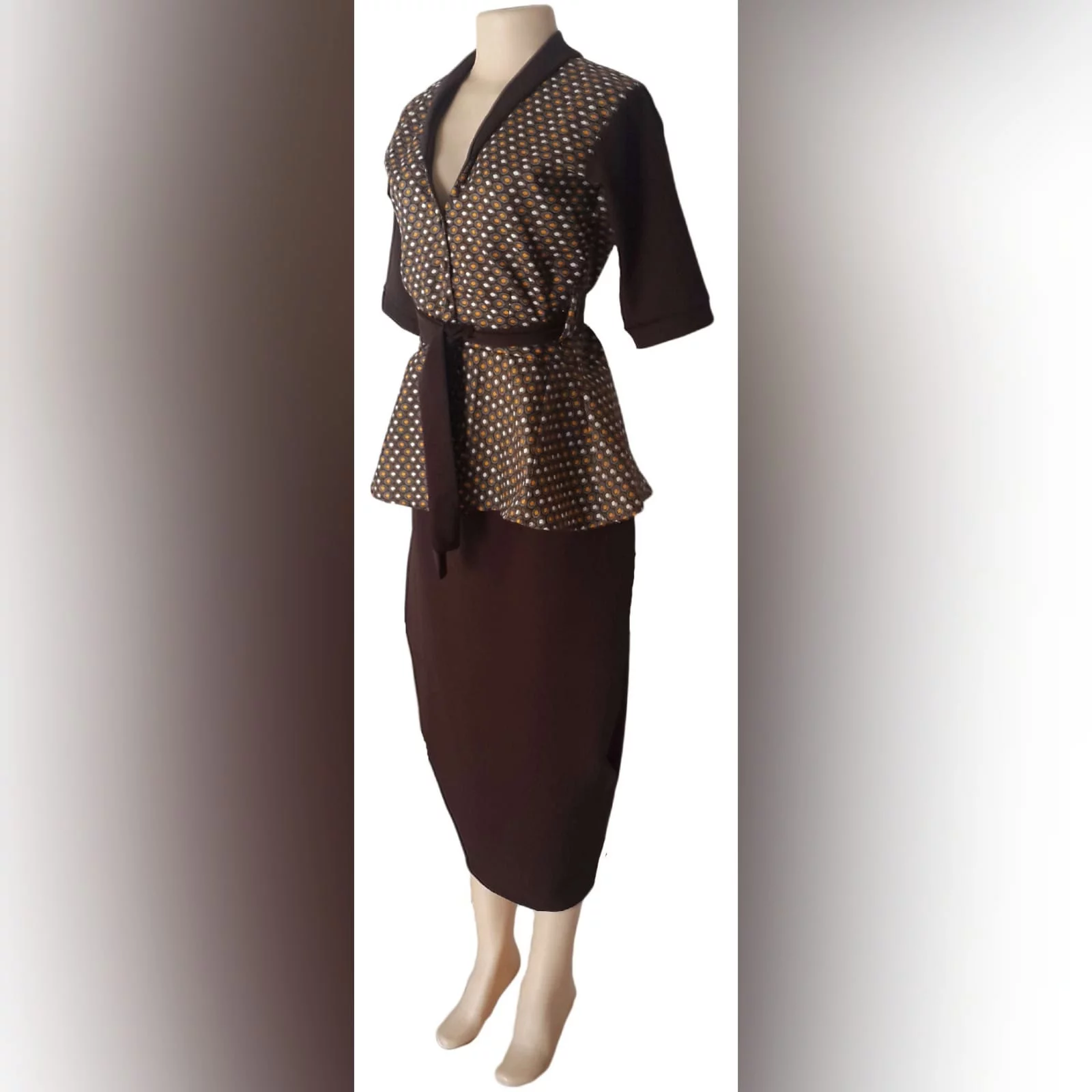 Xhosa traditional wear blouse and matching brown pencil skirt 2 a pencil skirt below the knee with a back slit. With a xhosa traditional blouse. Blouse with sleeves, collar and belt in brown matching the skirt.