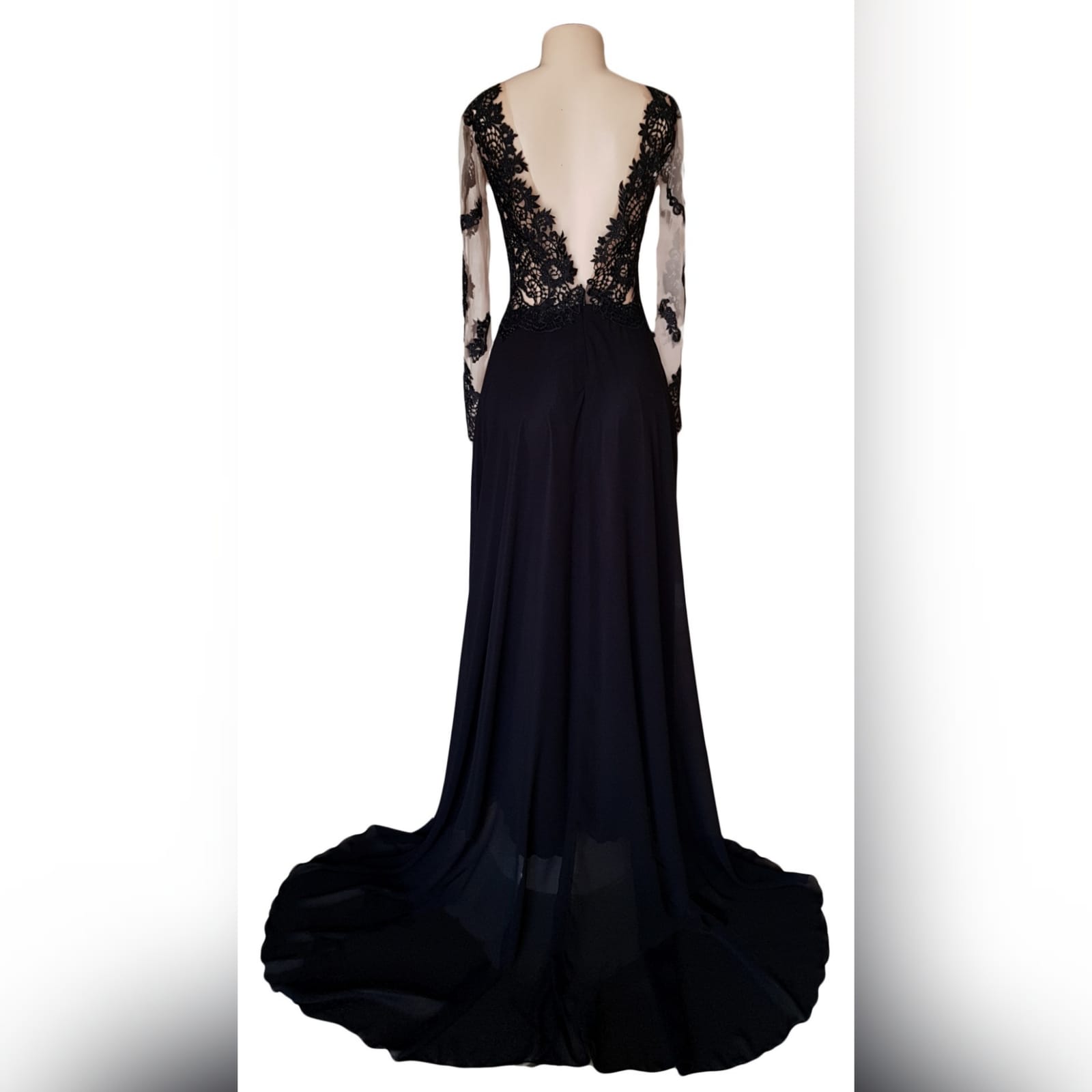 Black lace long flowy prom dress 3 black lace long flowy prom dress with an illusion plunging neckline, long illusion lace sleeves, v open back with a train and a slit.